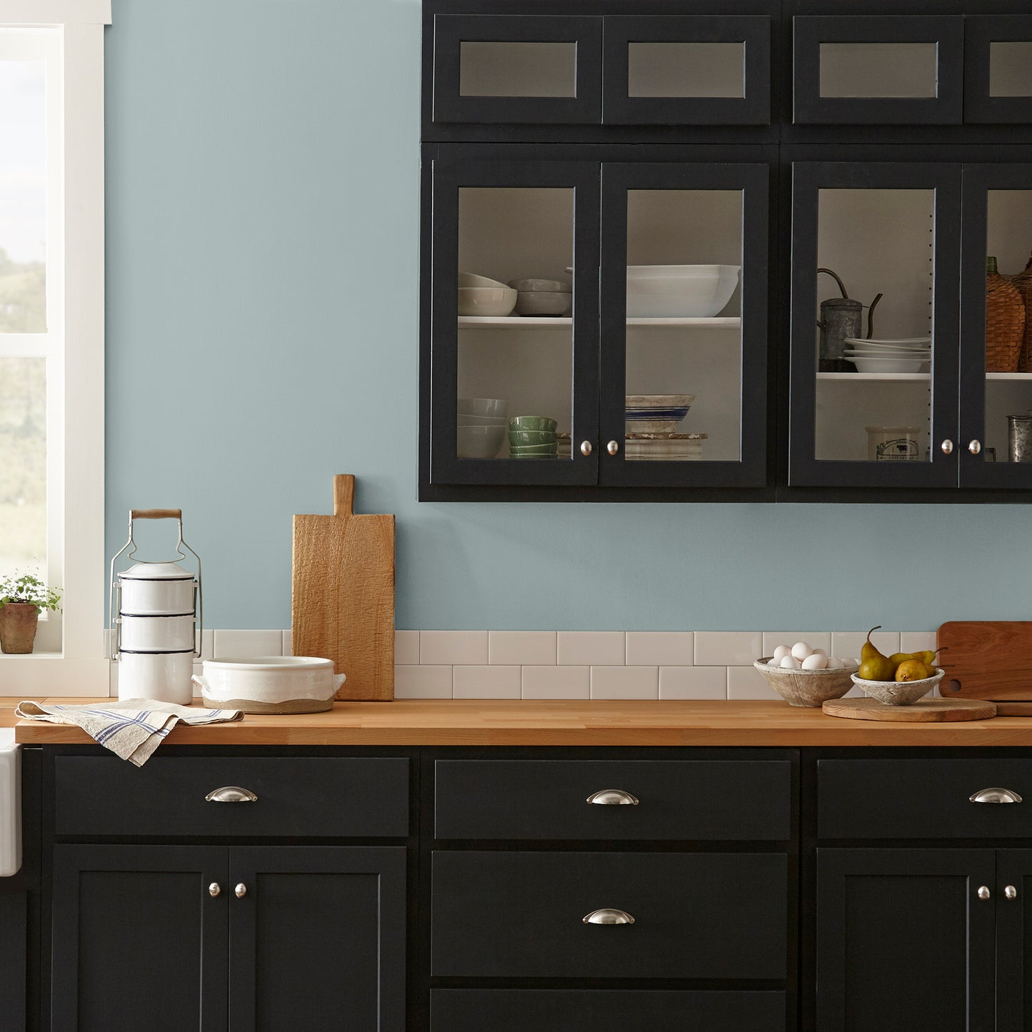 muted grey blue interior paint named rainy days shown painted on kitchen wall
