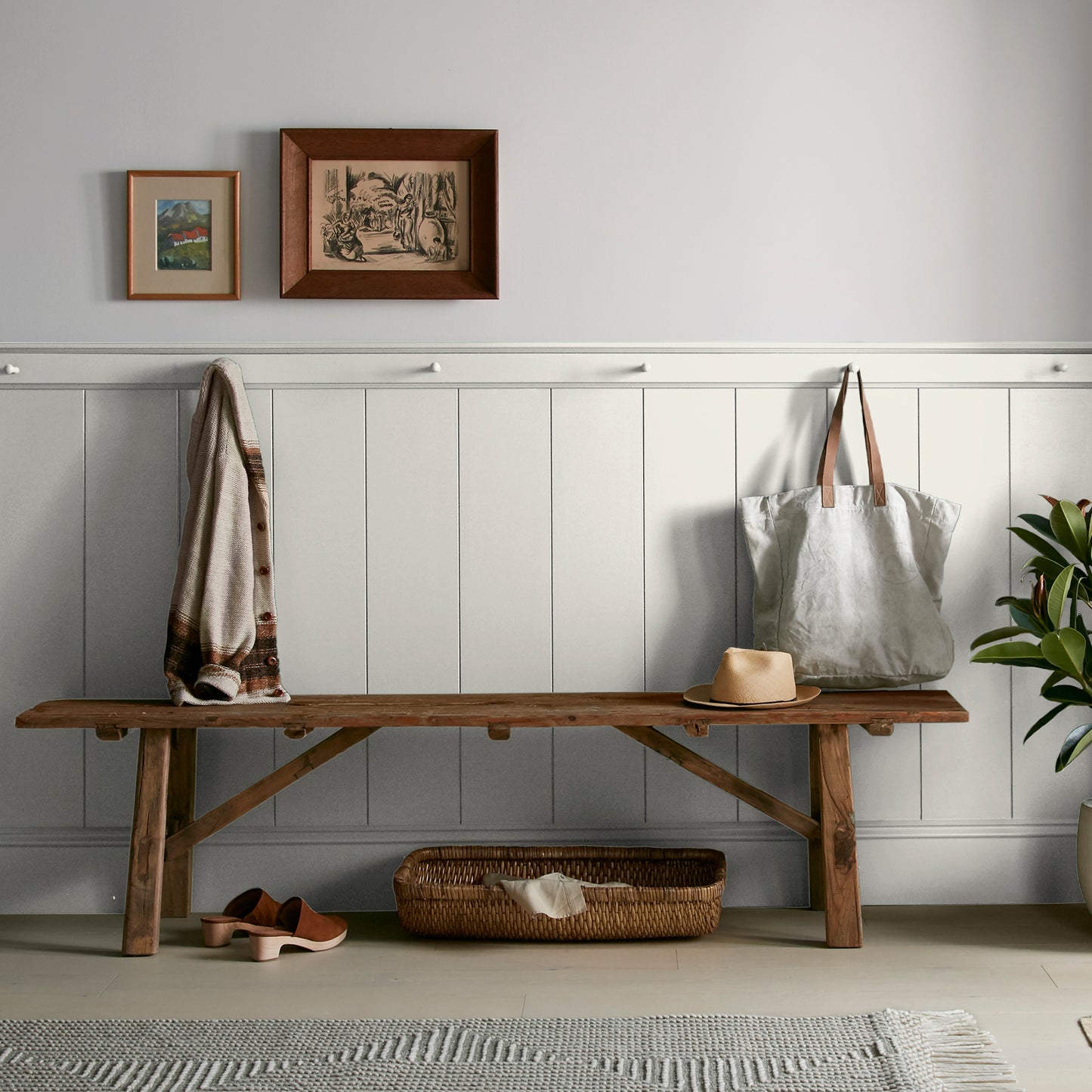 creamy weathered white interior paint named shiplap shown painted on entryway wall