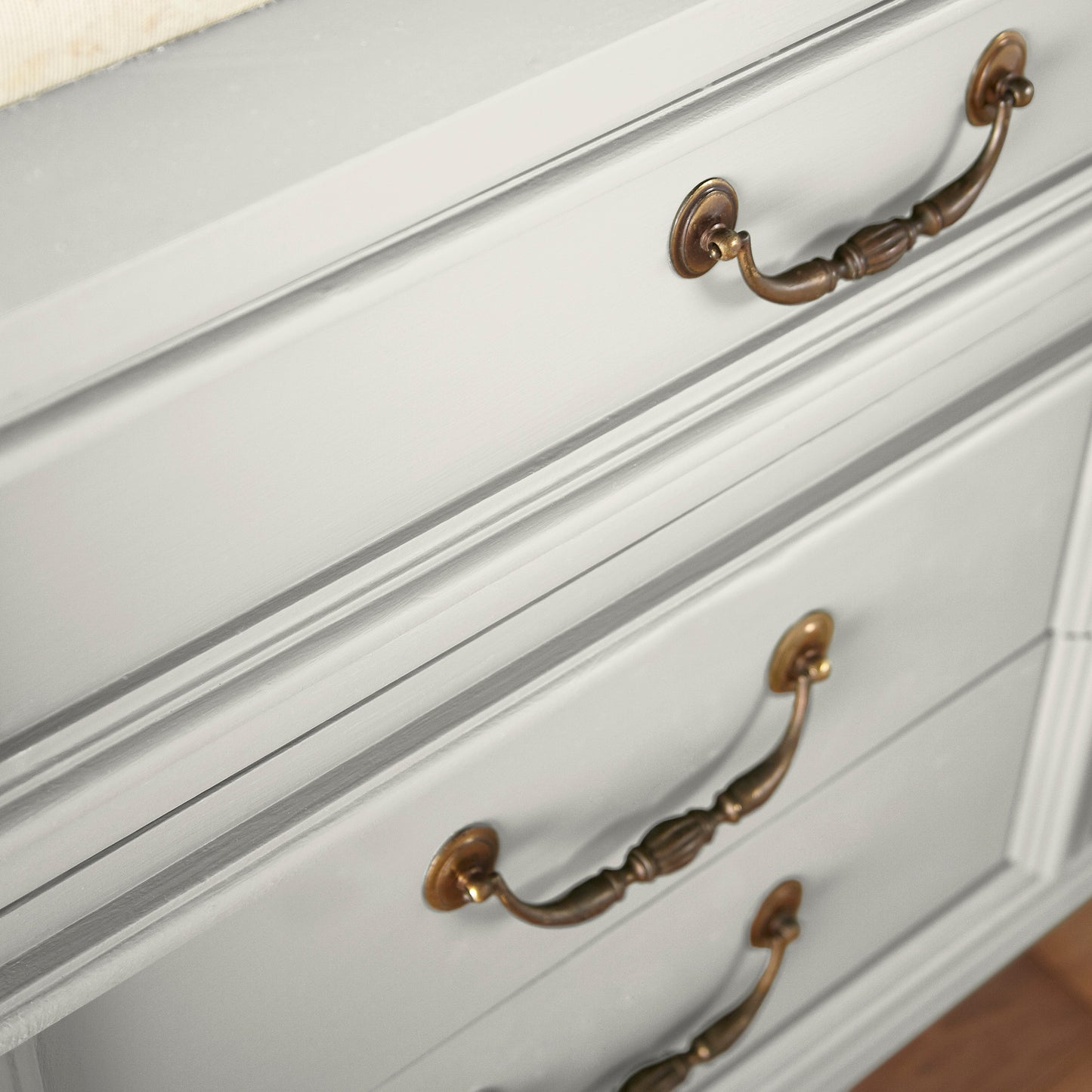 creamy off-white paint named shiplap shown painted on cabinet