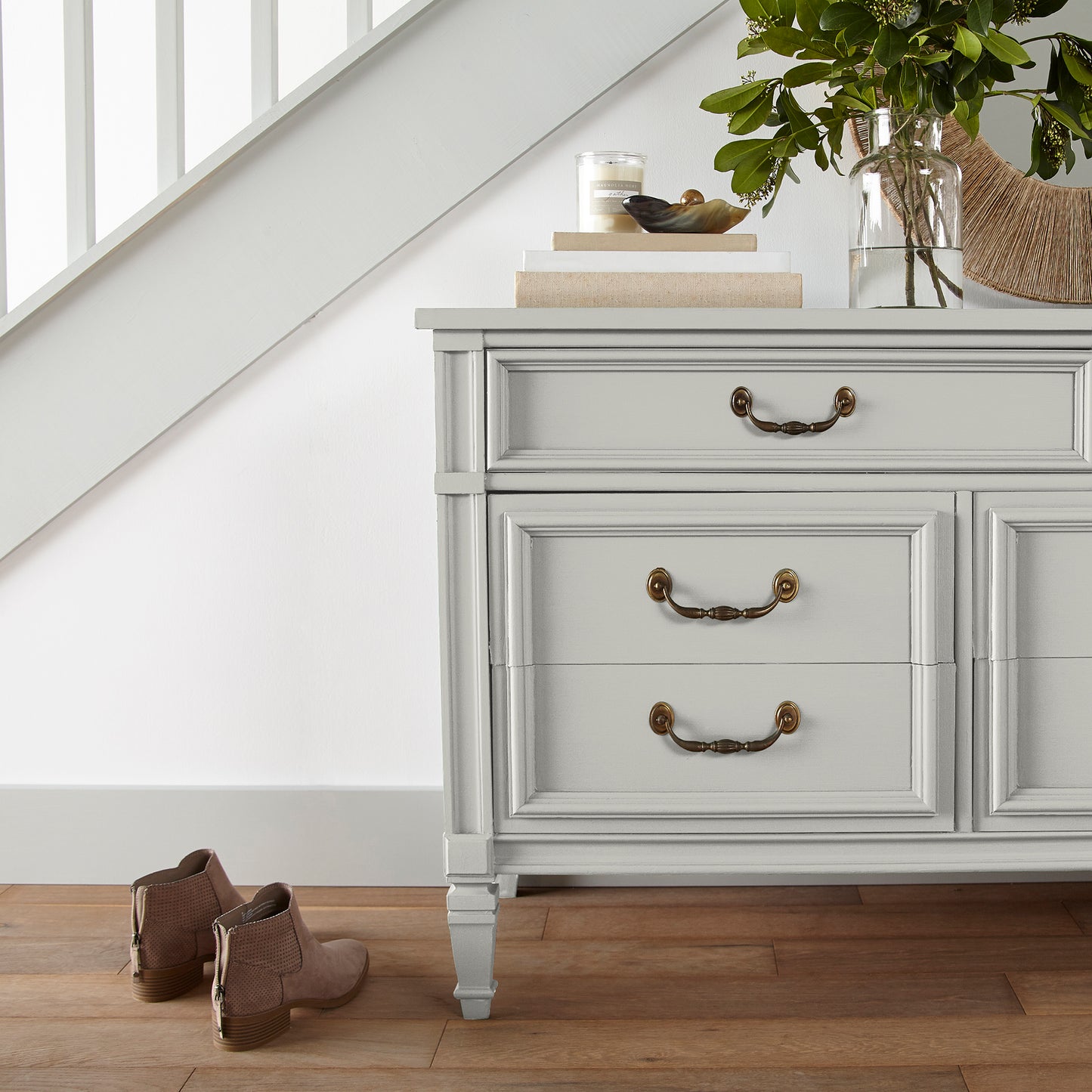 creamy off-white paint named shiplap shown painted on entryway cabinet
