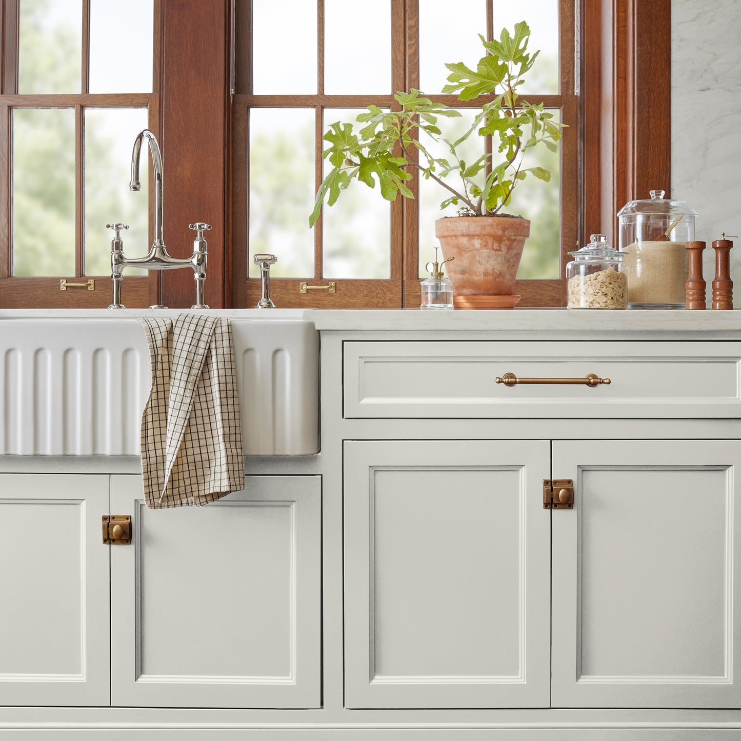 creamy off-white paint named shiplap shown painted on kitchen cabinet