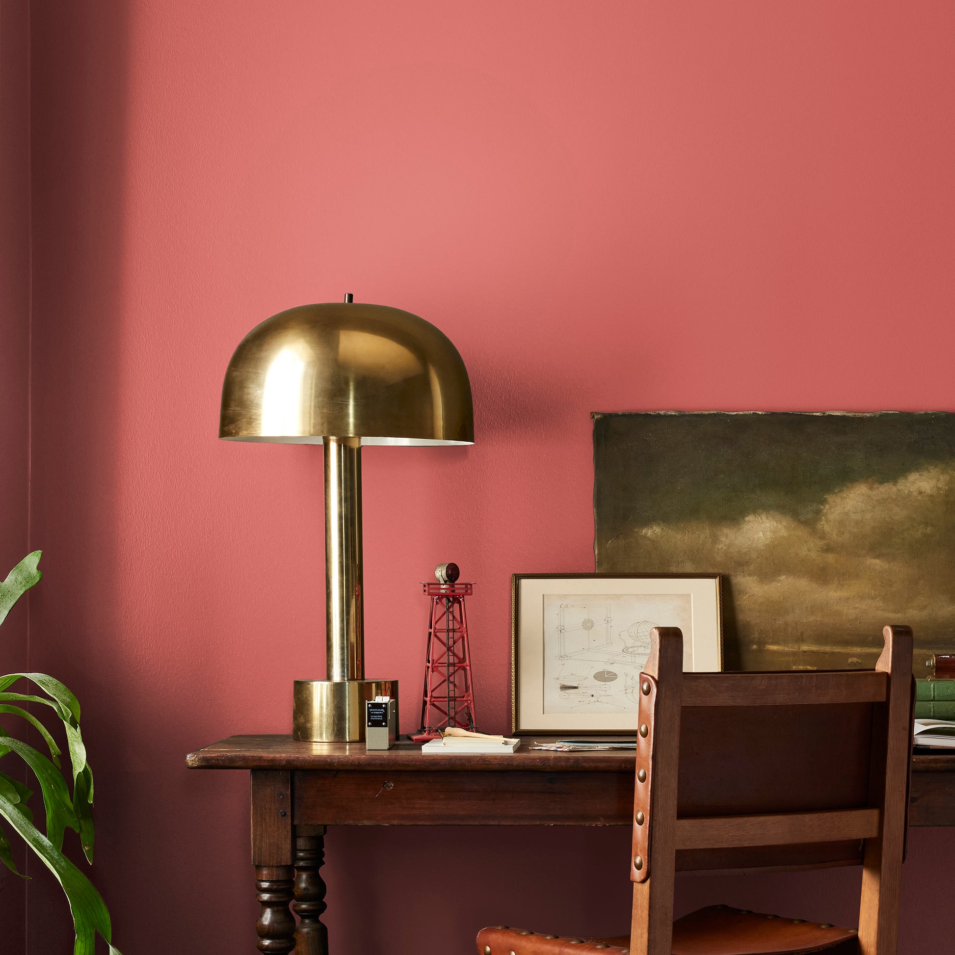 vibrant red with orange undertones interior paint named ripened tomato shown painted on bedroom wall
