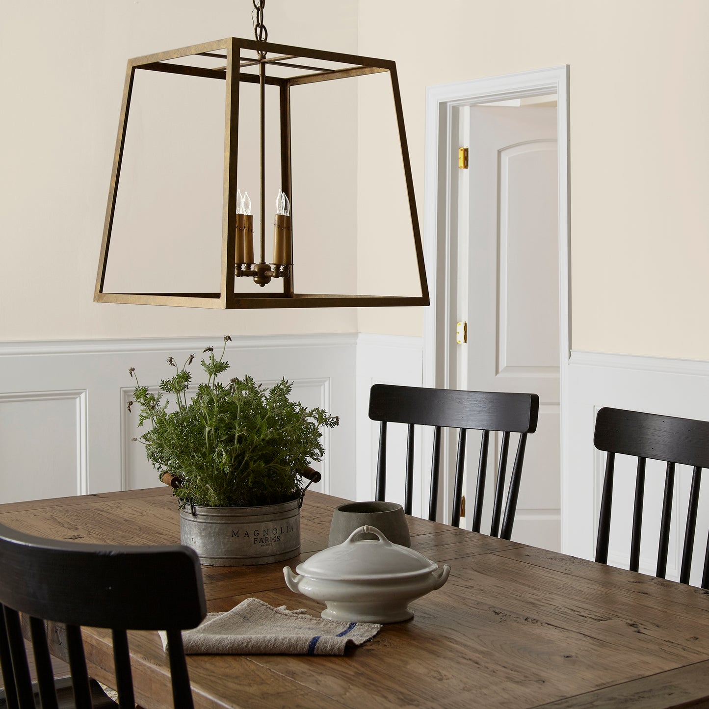 warm honey yellow interior paint named carter creme shown painted on dining room wall