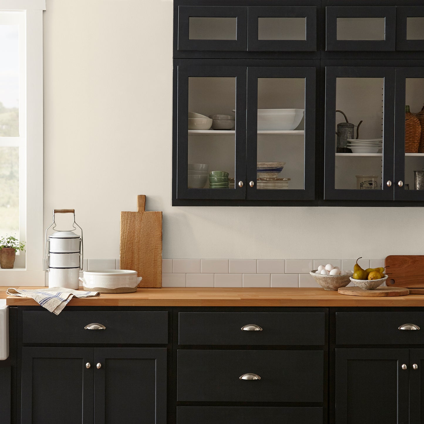 warm honey yellow interior paint named carter creme shown painted on kitchen wall