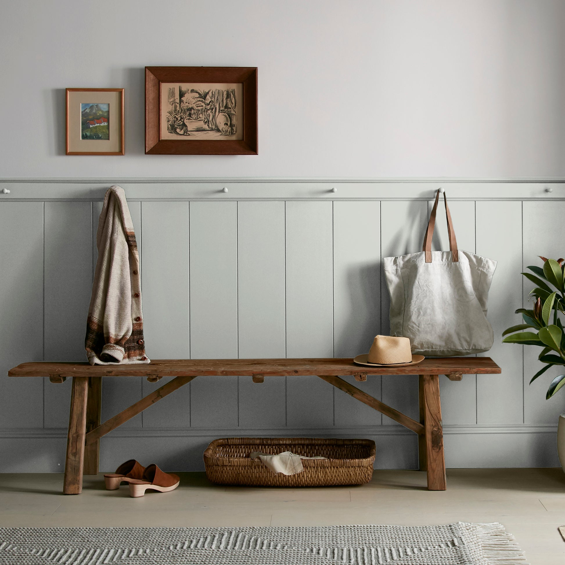 Silver gray tinted with sky blue interior paint named wedding band shown painted on entryway wall