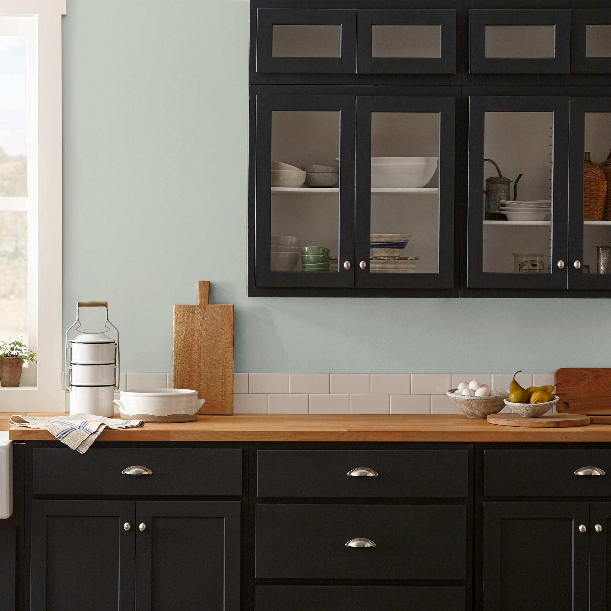 Silver gray tinted with sky blue interior paint named wedding band shown painted on kitchen wall