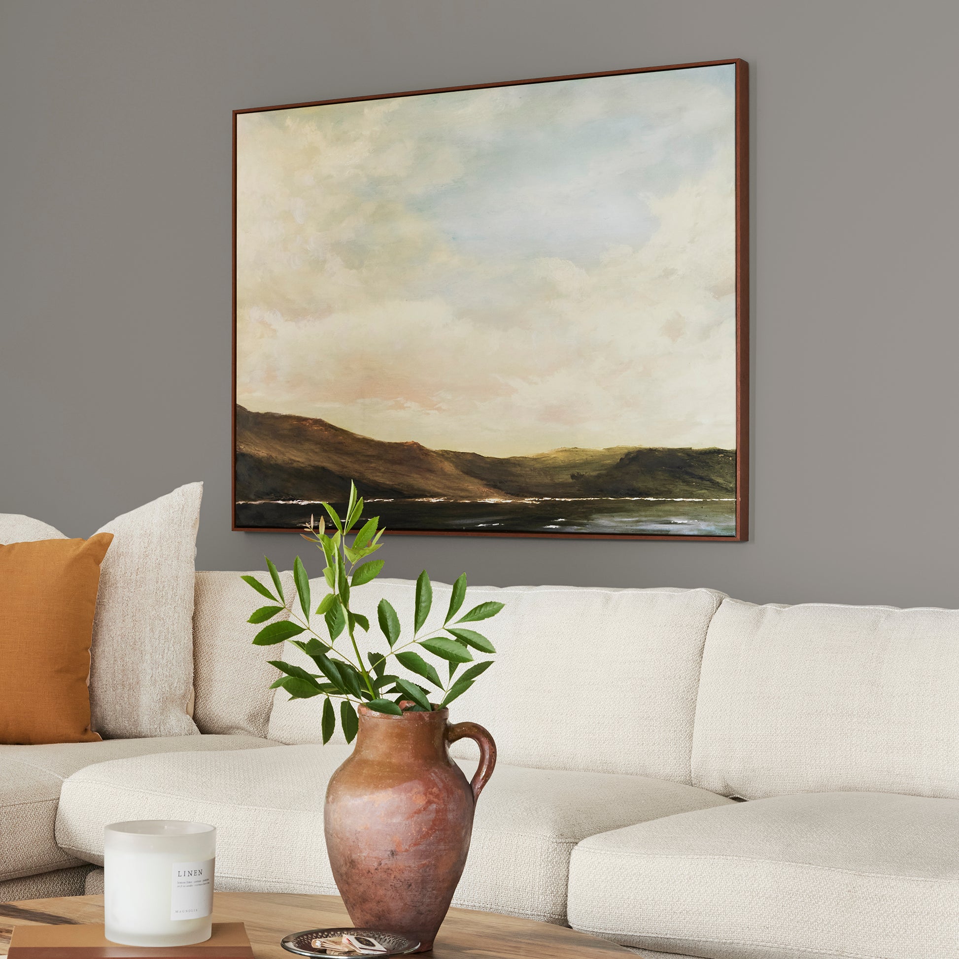 dark grey with olive-brown undertones paint named garden trowel shown painted on living room wall