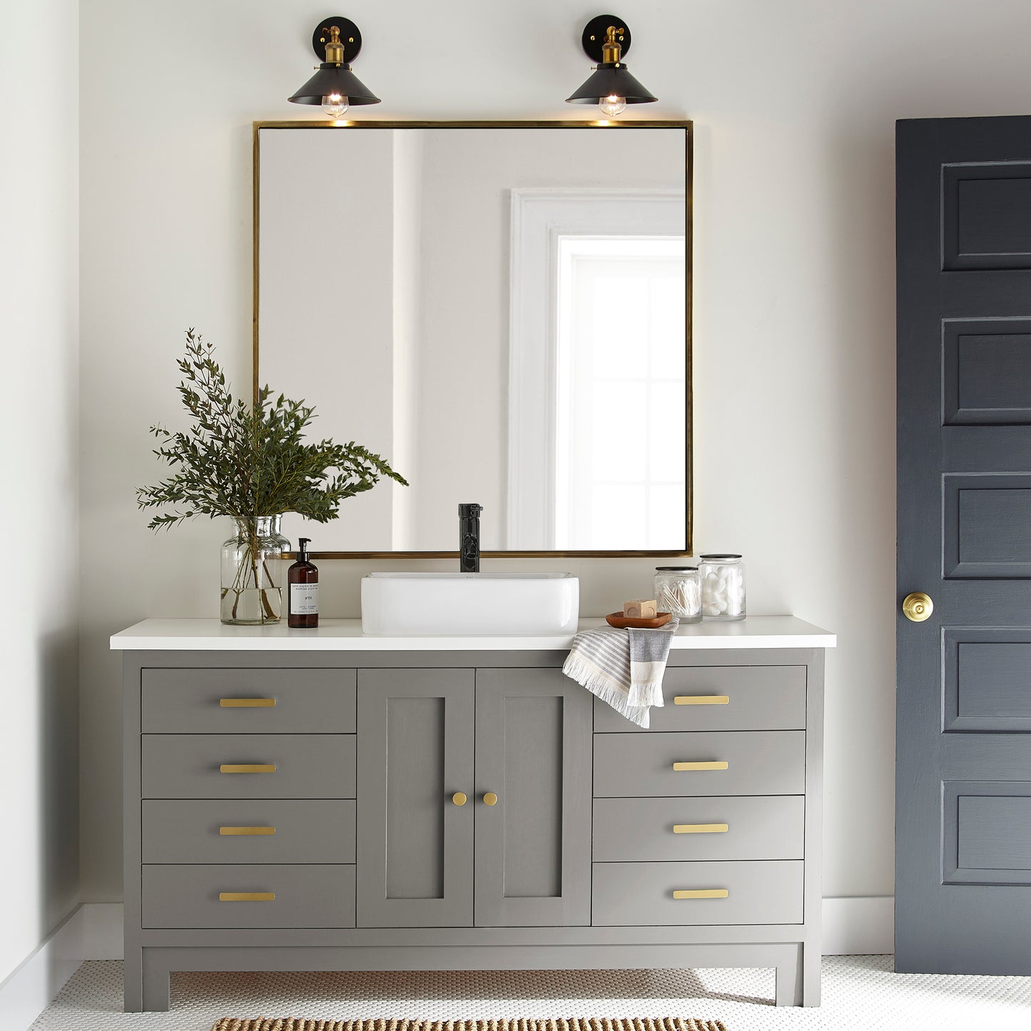 dark grey with olive-brown undertones paint named garden trowel shown painted on bathroom cabinet