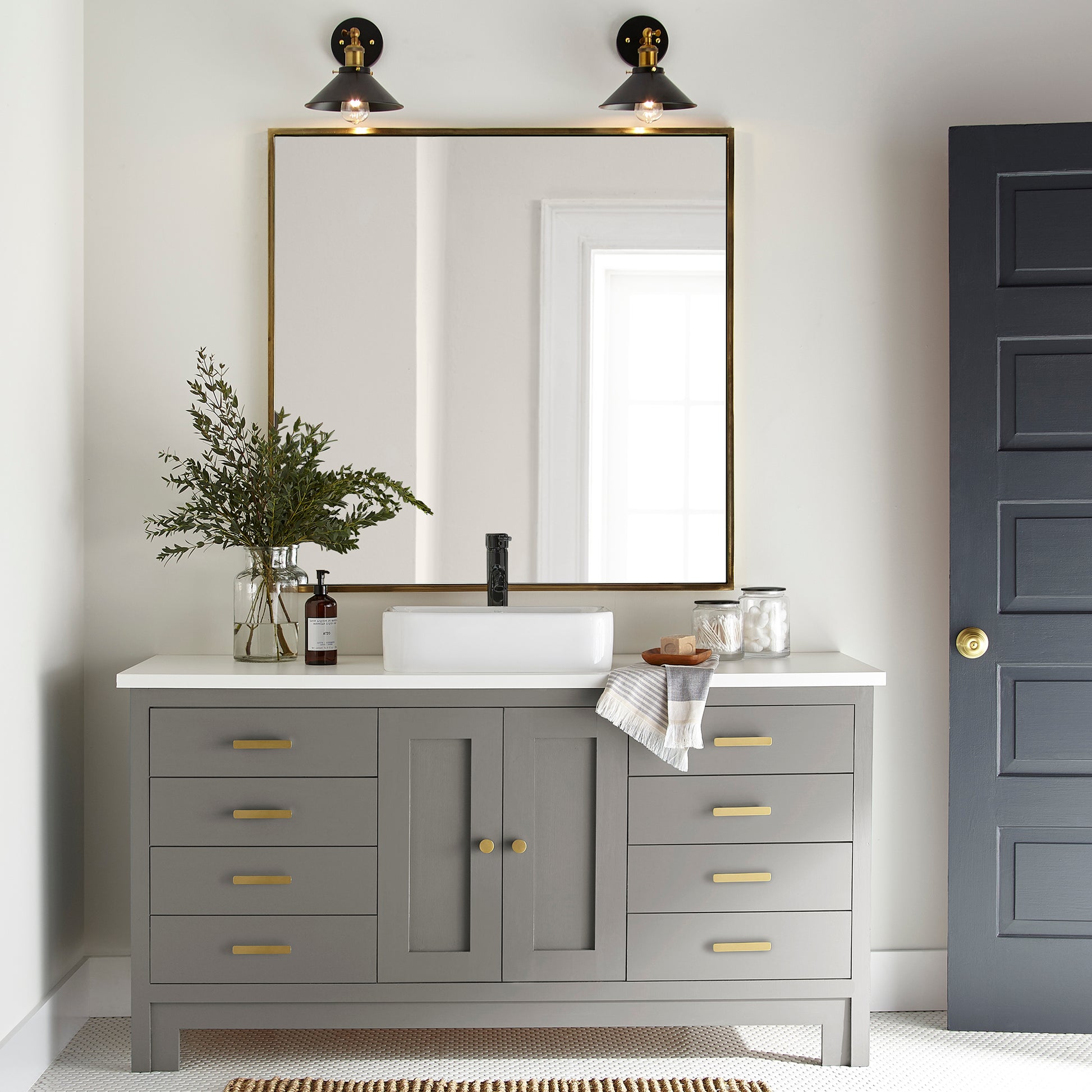dark grey with olive-brown undertones paint named garden trowel shown painted on bathroom cabinet