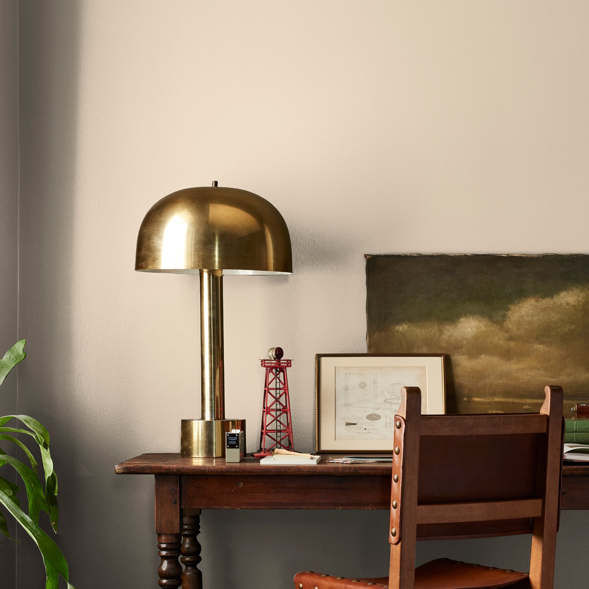 light tan with a yellow undertone paint named soft landing shown painted on bedroom wall
