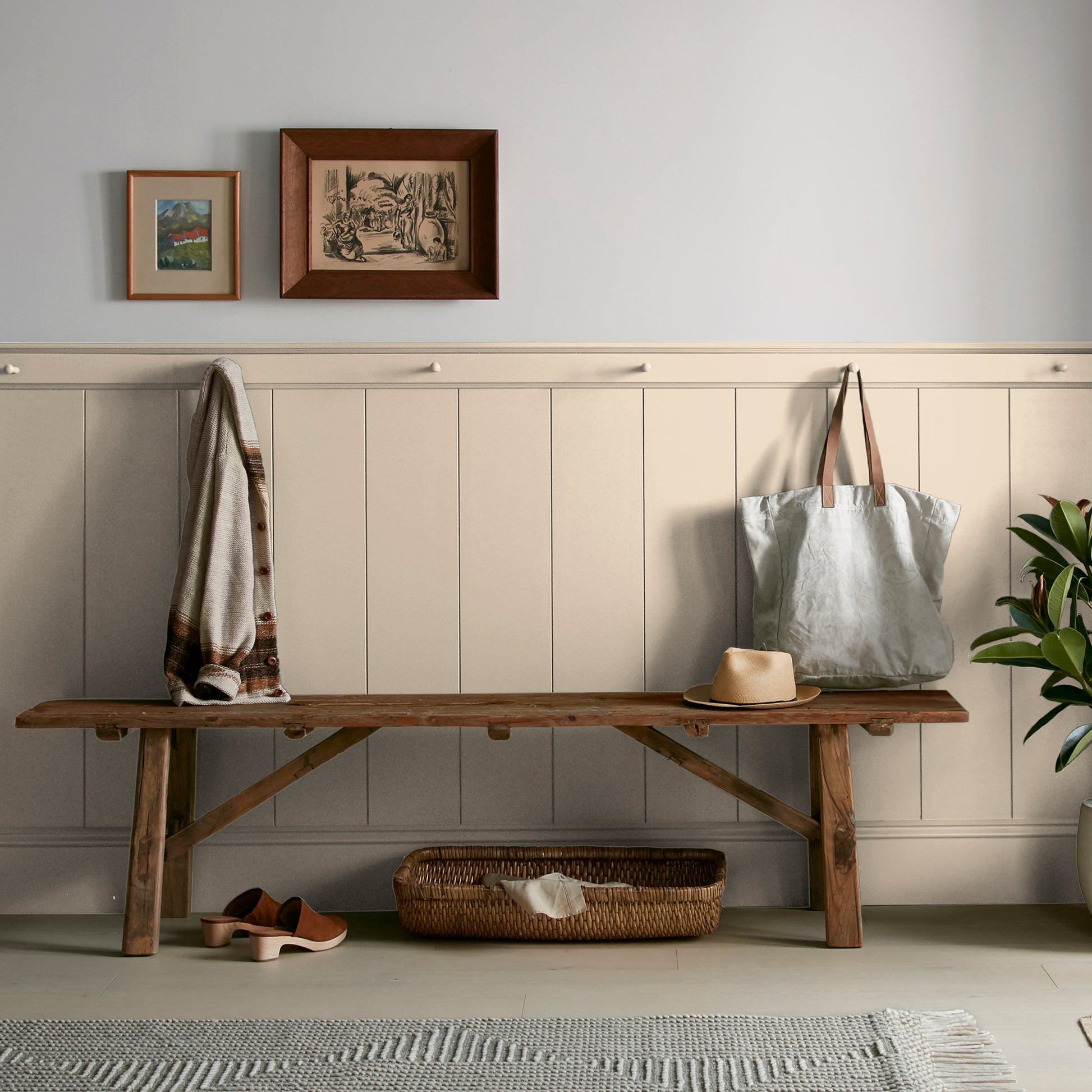 light tan with a yellow undertone paint named soft landing shown painted on entryway wall
