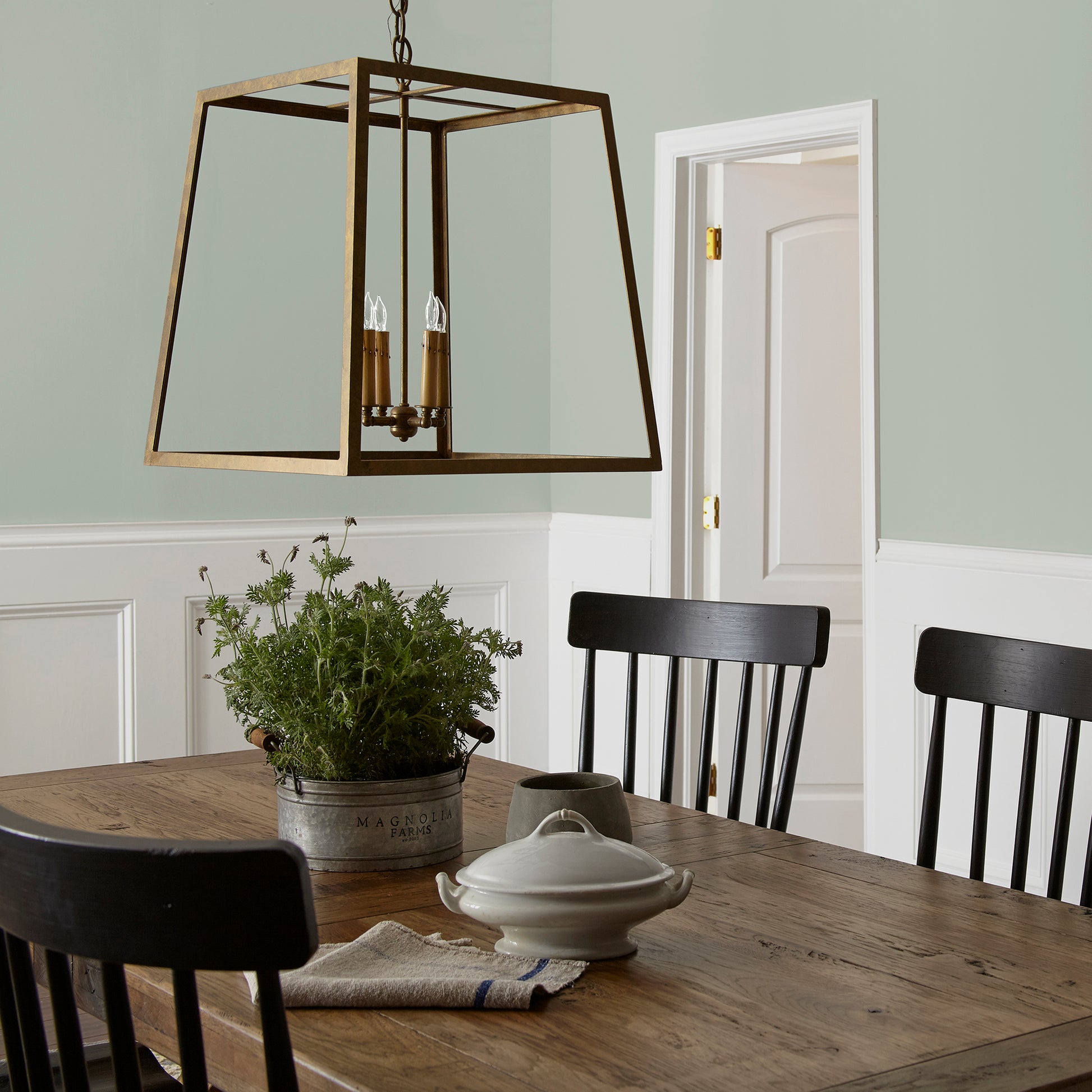medium grey with cool green blue undertones paint name americana egg shown painted on dining room wall