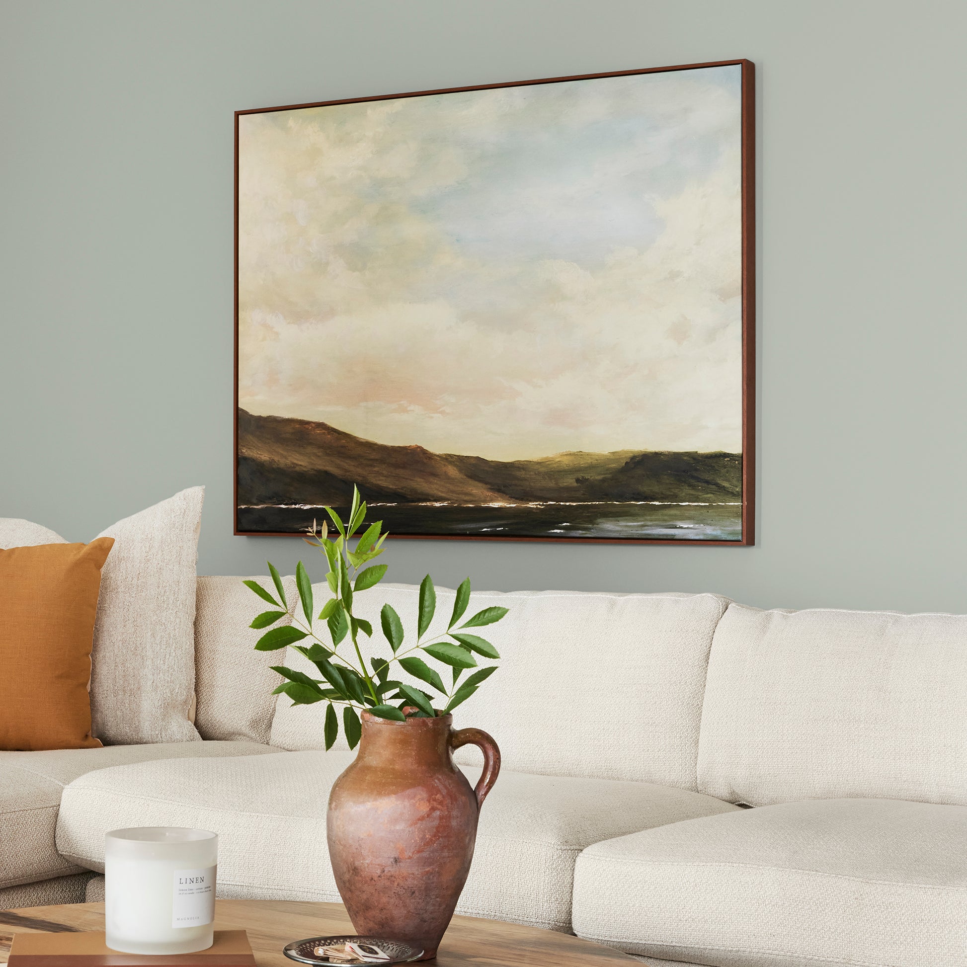 medium grey with cool green blue undertones paint name americana egg shown painted on living room wall