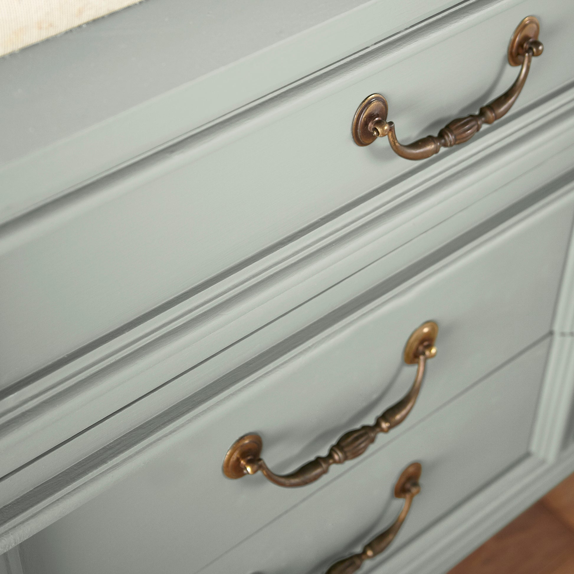 medium grey with cool blue undertones door and cabinet paint named americana egg shown painted on cabinet