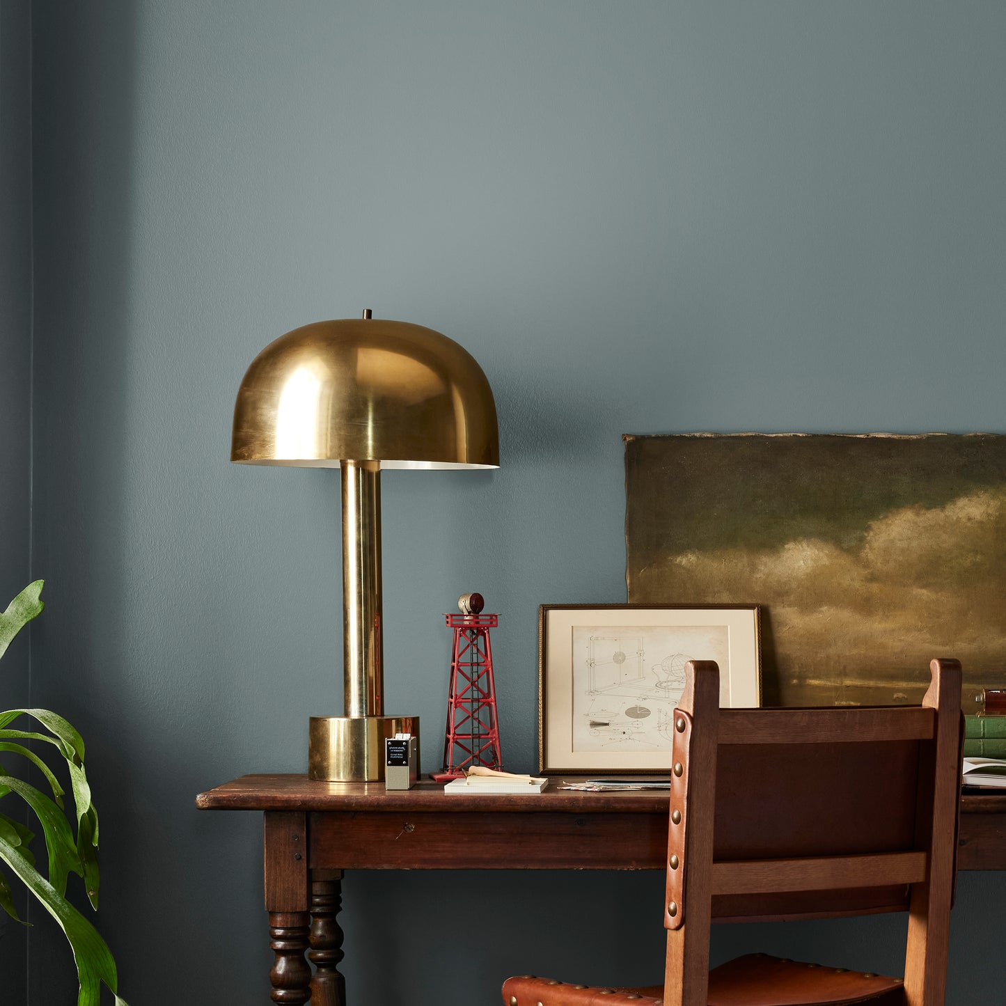deep muted blue with grey undertones paint named duke gray shown painted on bedroom wall