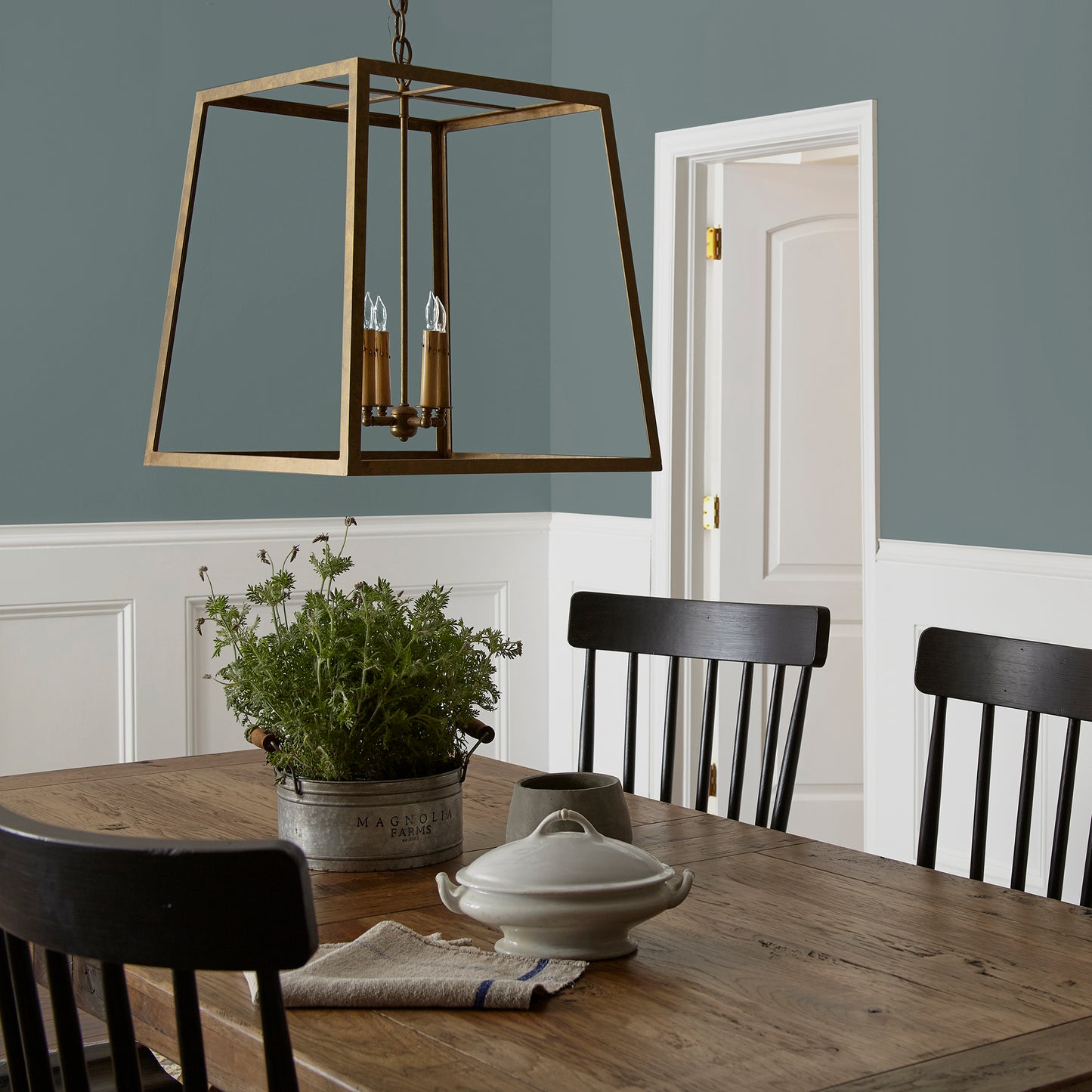 deep muted blue with grey undertones paint named duke gray shown painted on dining room wall