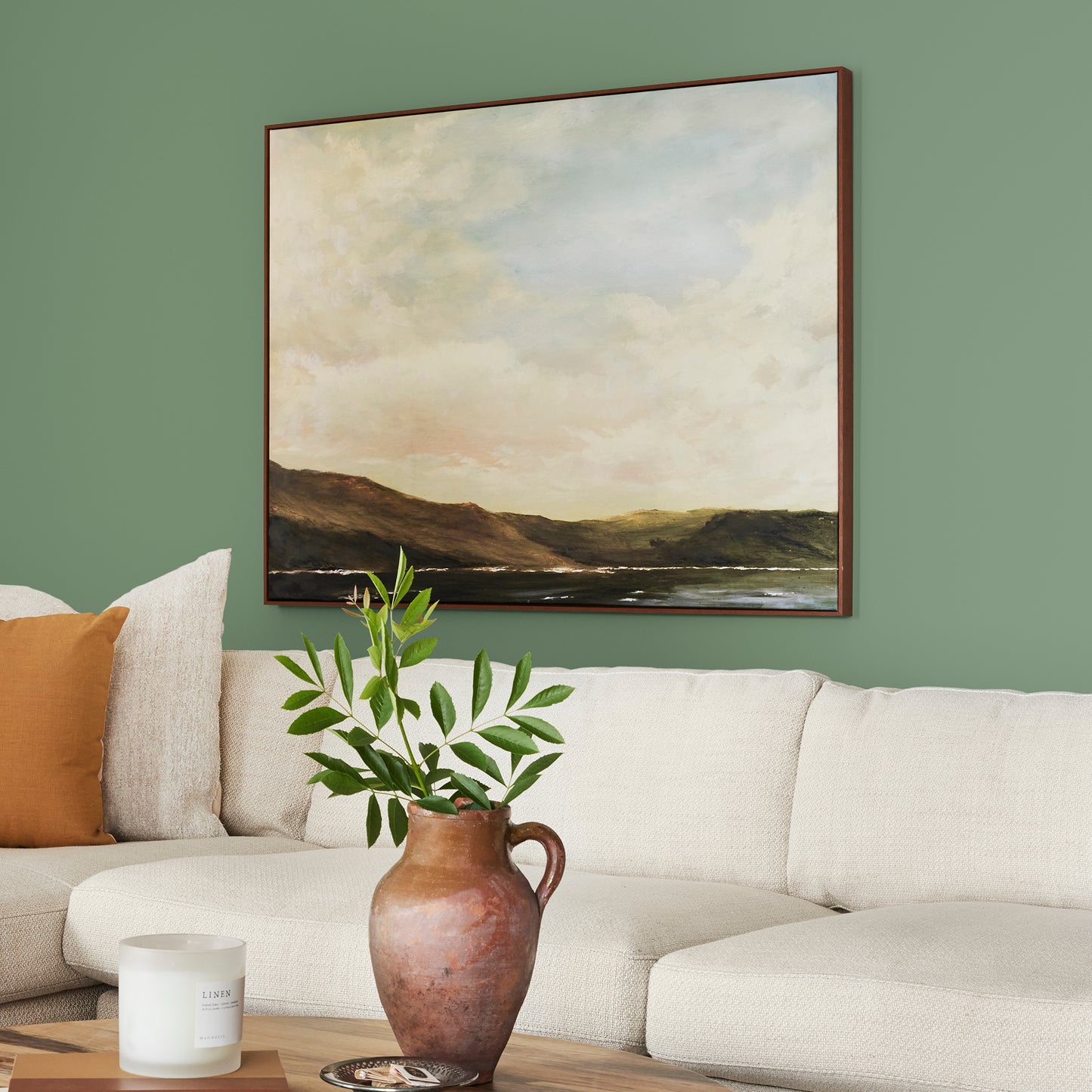 evergreen green paint named magnolia green shown painted on living room wall