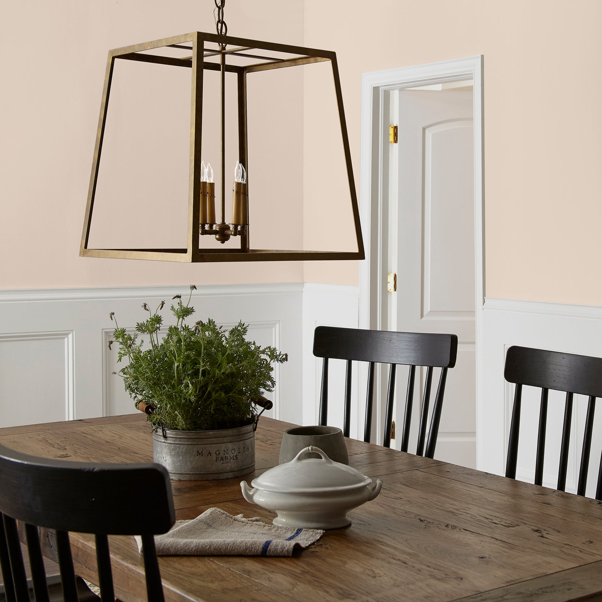 Warm soft peach interior paint named dutch tulip shown painted on dining room wall