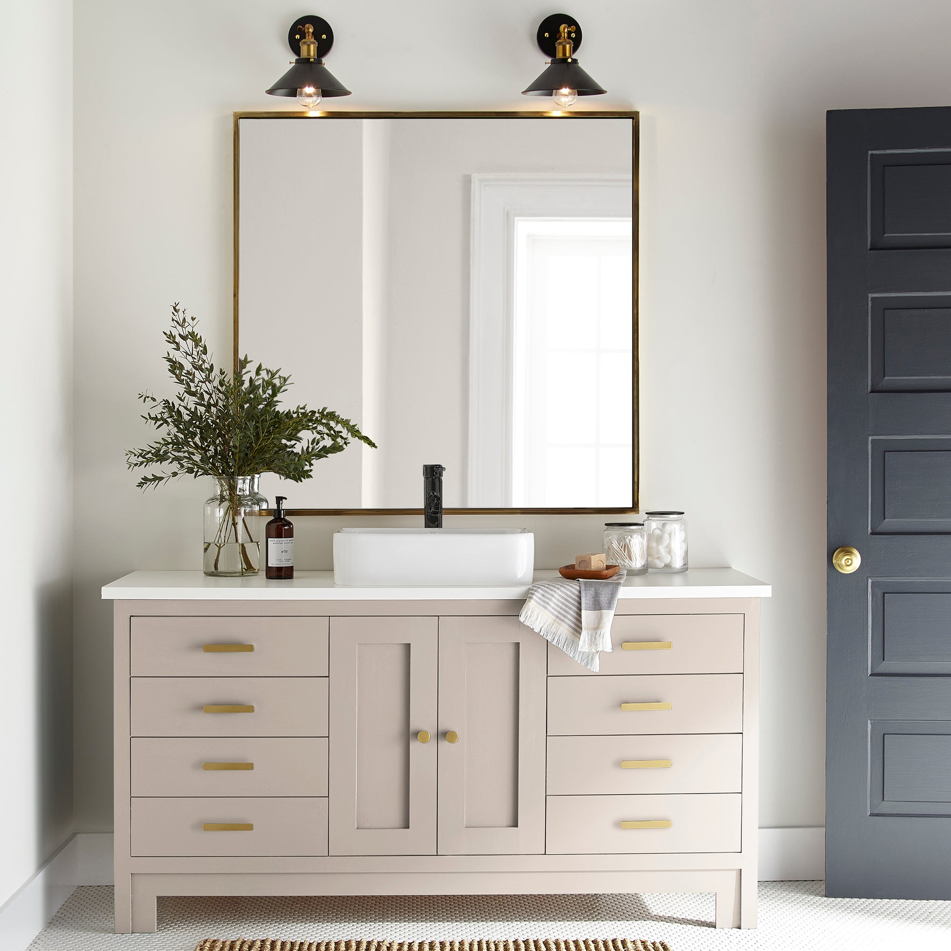 Warm soft peach trim, door and cabinetry paint named dutch tulip shown painted on bathroom cabinet
