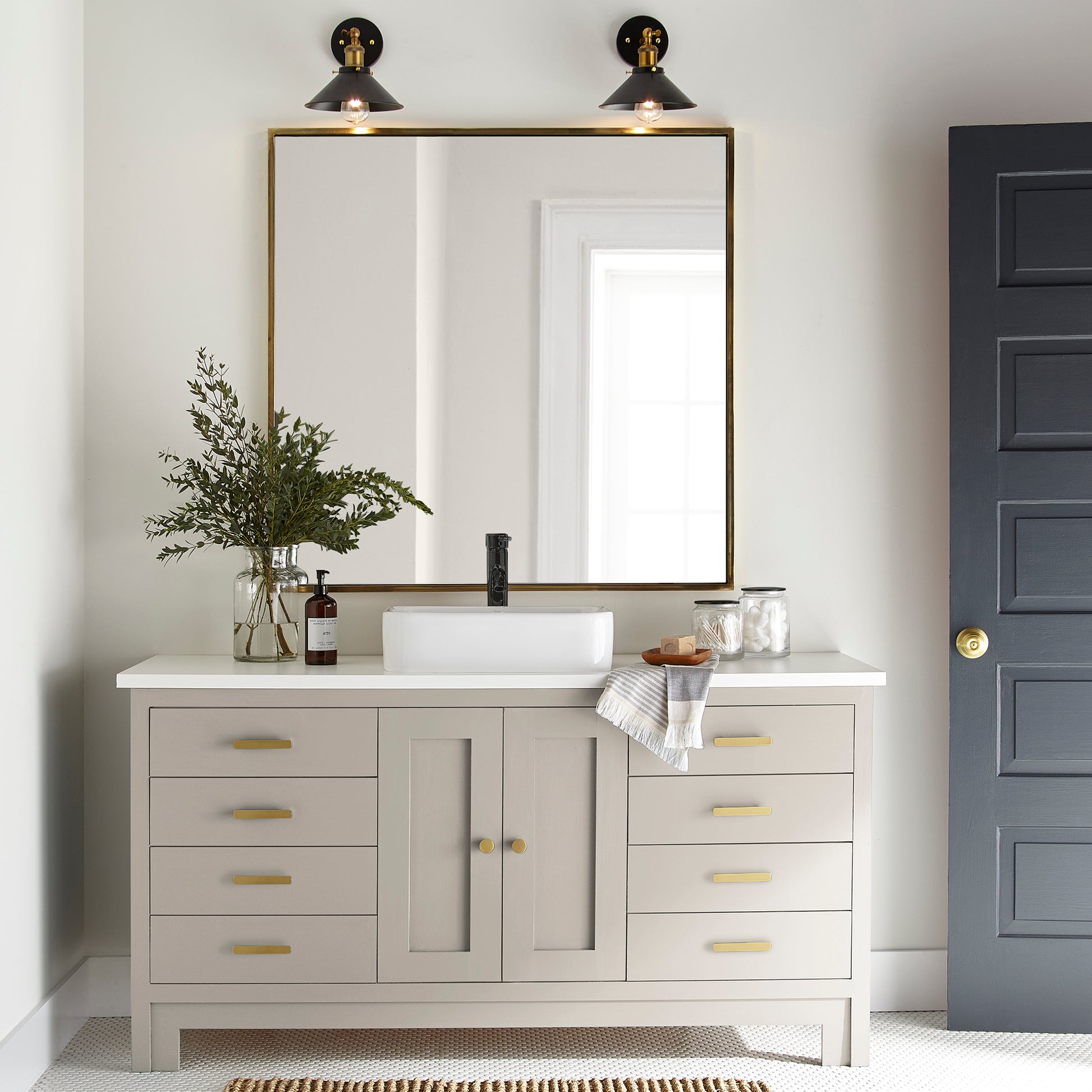 Oatmeal white with peach accents door and cabinet paint named Soft Linen shown painted on bathroom cabinet