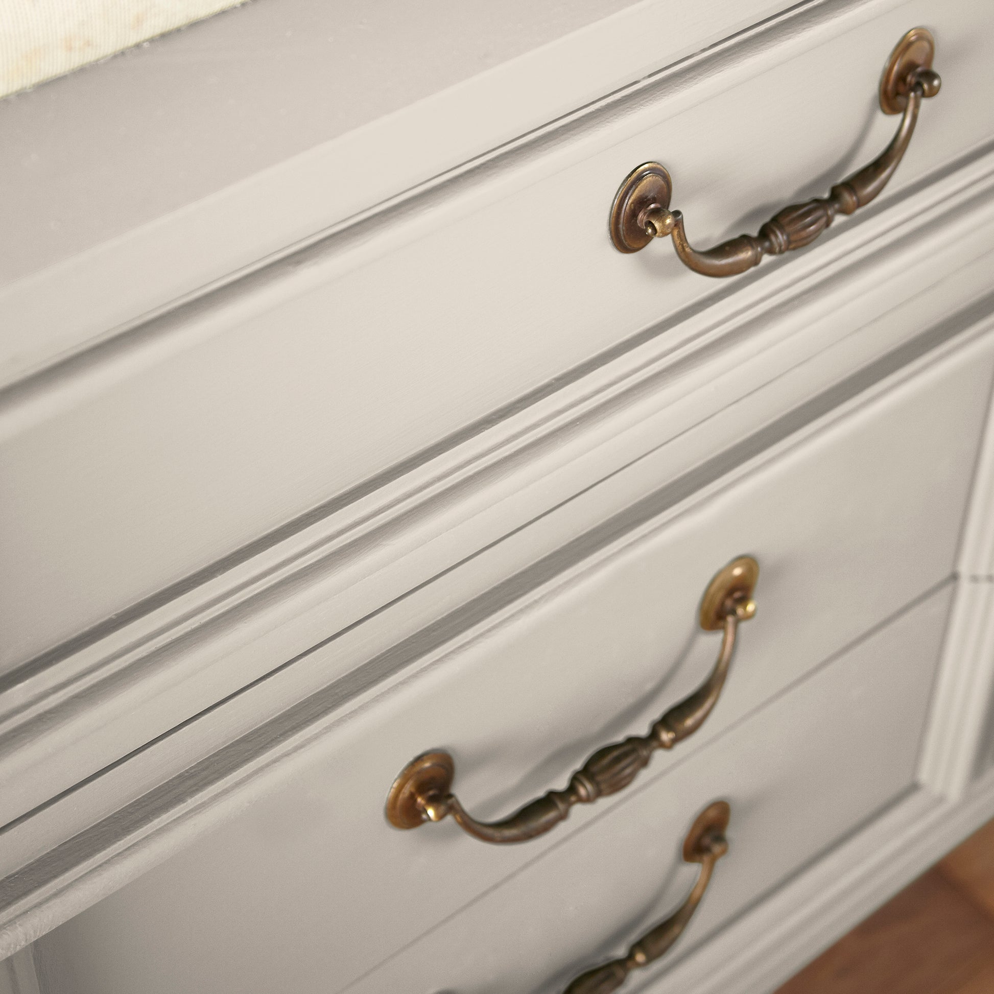 Oatmeal white with peach accents door and cabinet paint named Soft Linen shown painted on cabinet