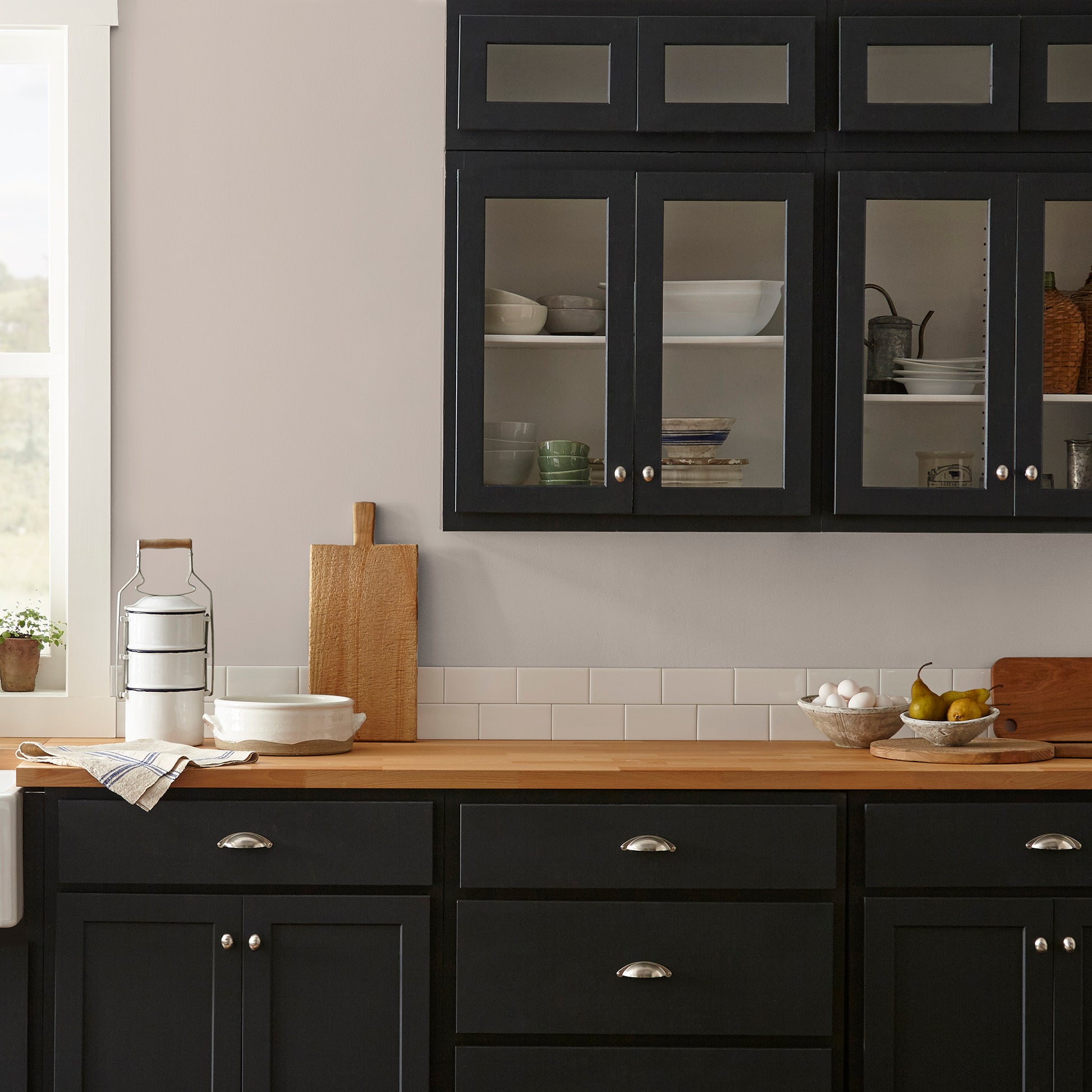 Sandy tan with pink notes interior paint named cinnamon sugar shown painted on kitchen wall