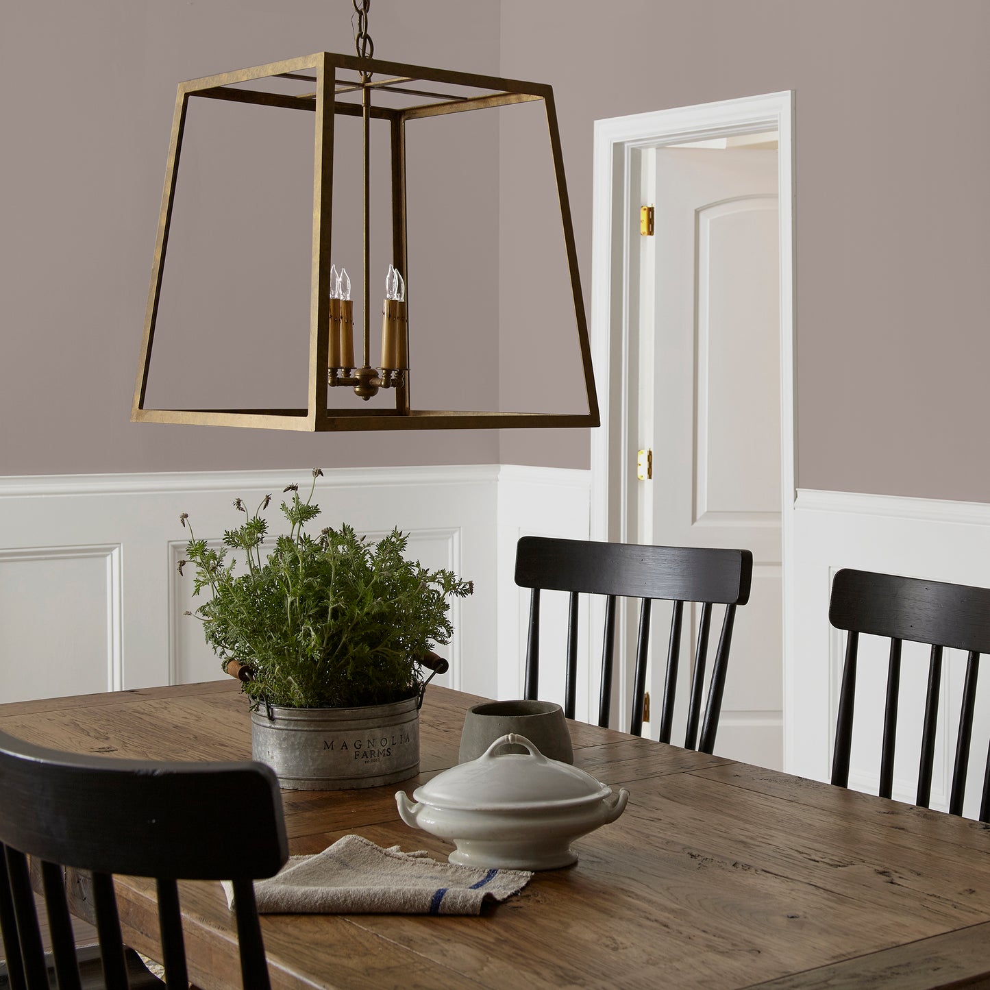 A mid-tone mauve interior paint named homebody shown painted on dining room wall