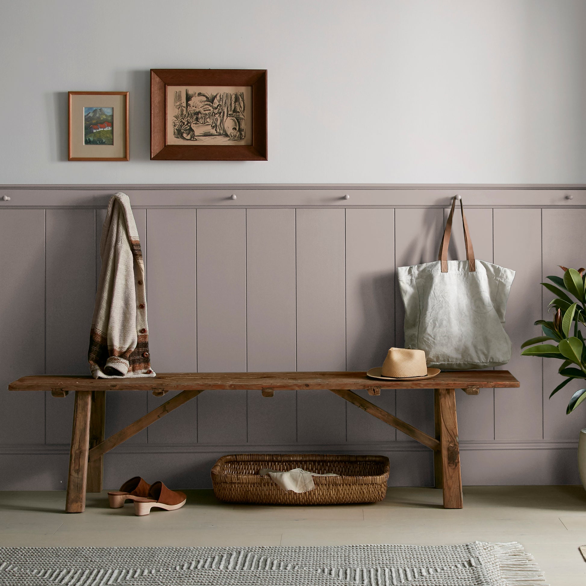 A mid-tone mauve interior paint named homebody shown painted on entryway wall