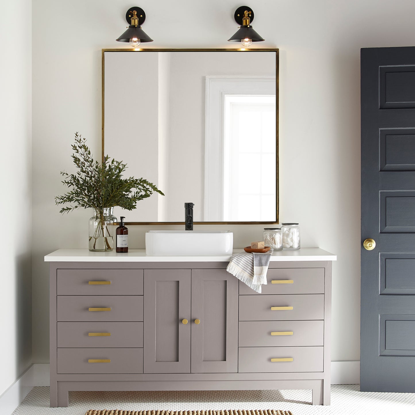 A mid-tone mauve door and cabinet paint named homebody shown painted on bathroom cabinet