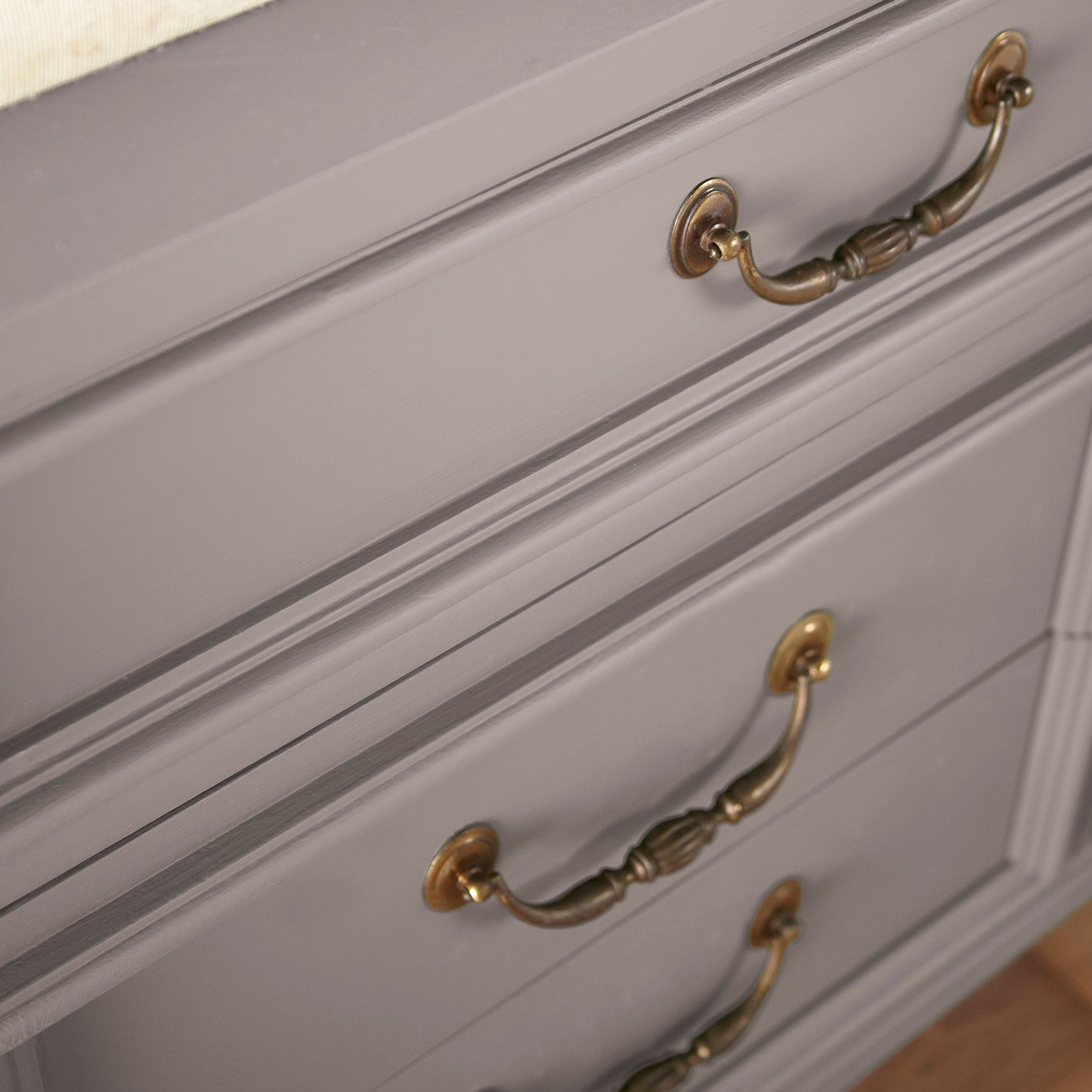 A mid-tone mauve door and cabinet paint named homebody shown painted on cabinet