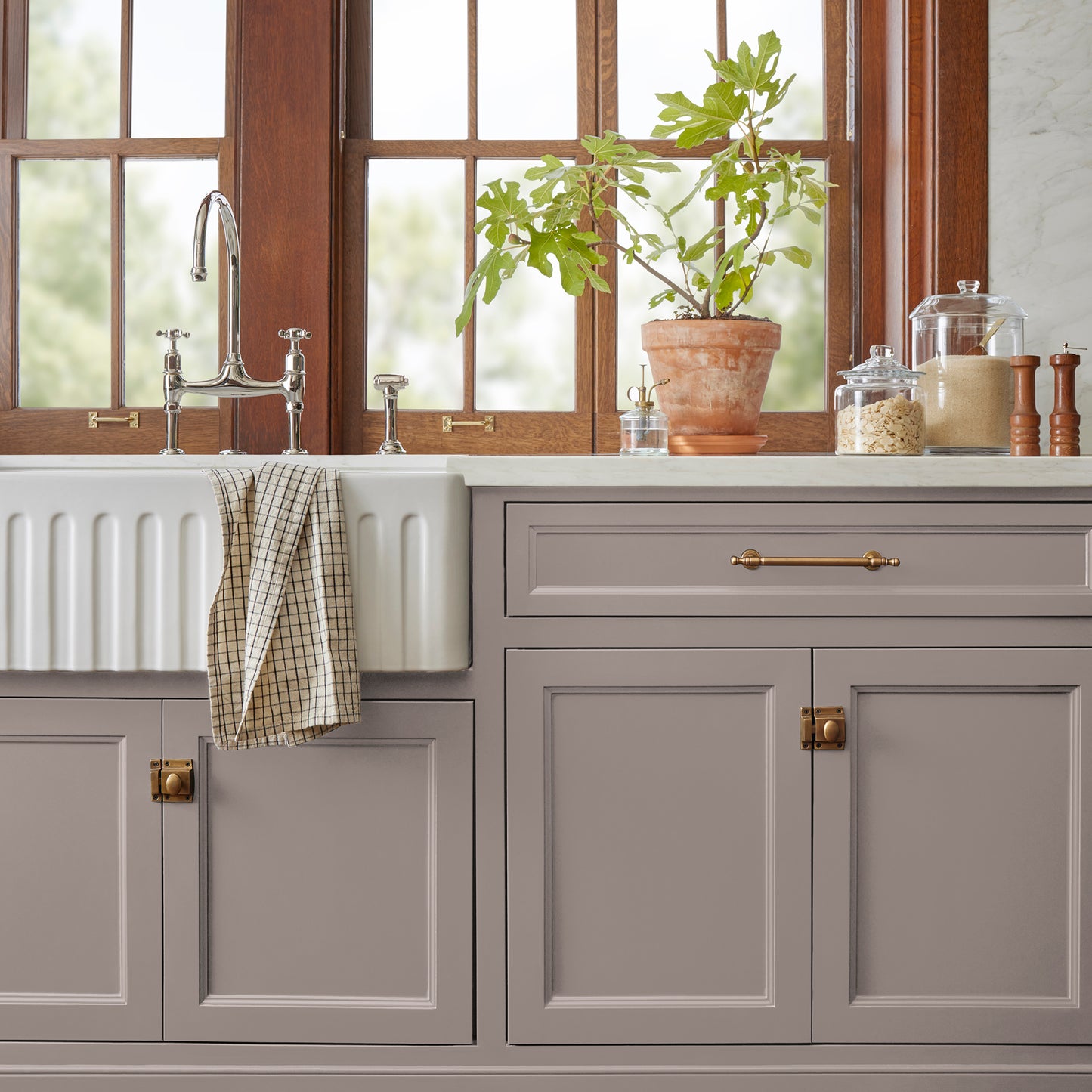A mid-tone mauve door and cabinet paint named homebody shown painted on kitchen cabinet