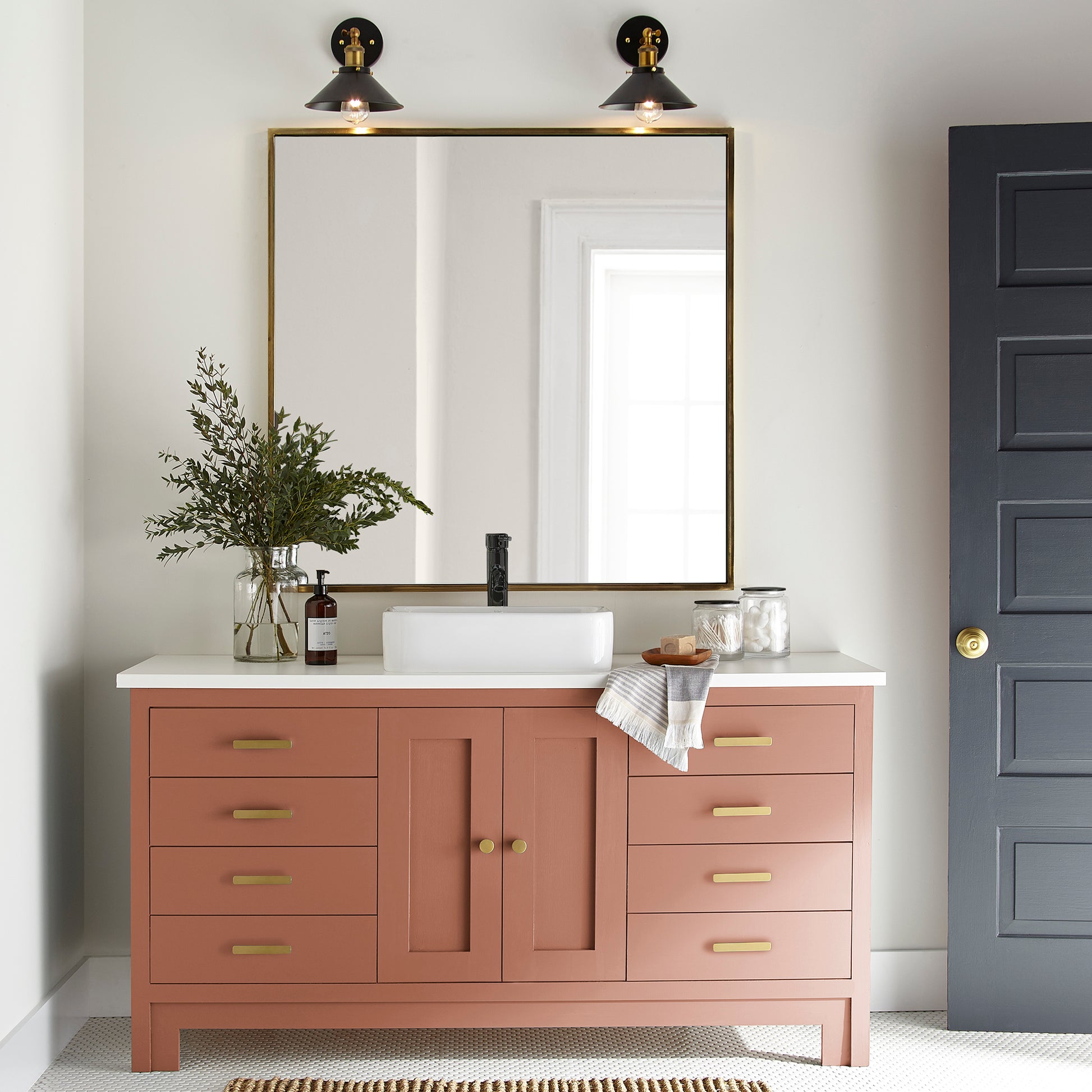 muted burnt orange door and cabinet paint named work worn wood shown painted on bathroom cabinet
