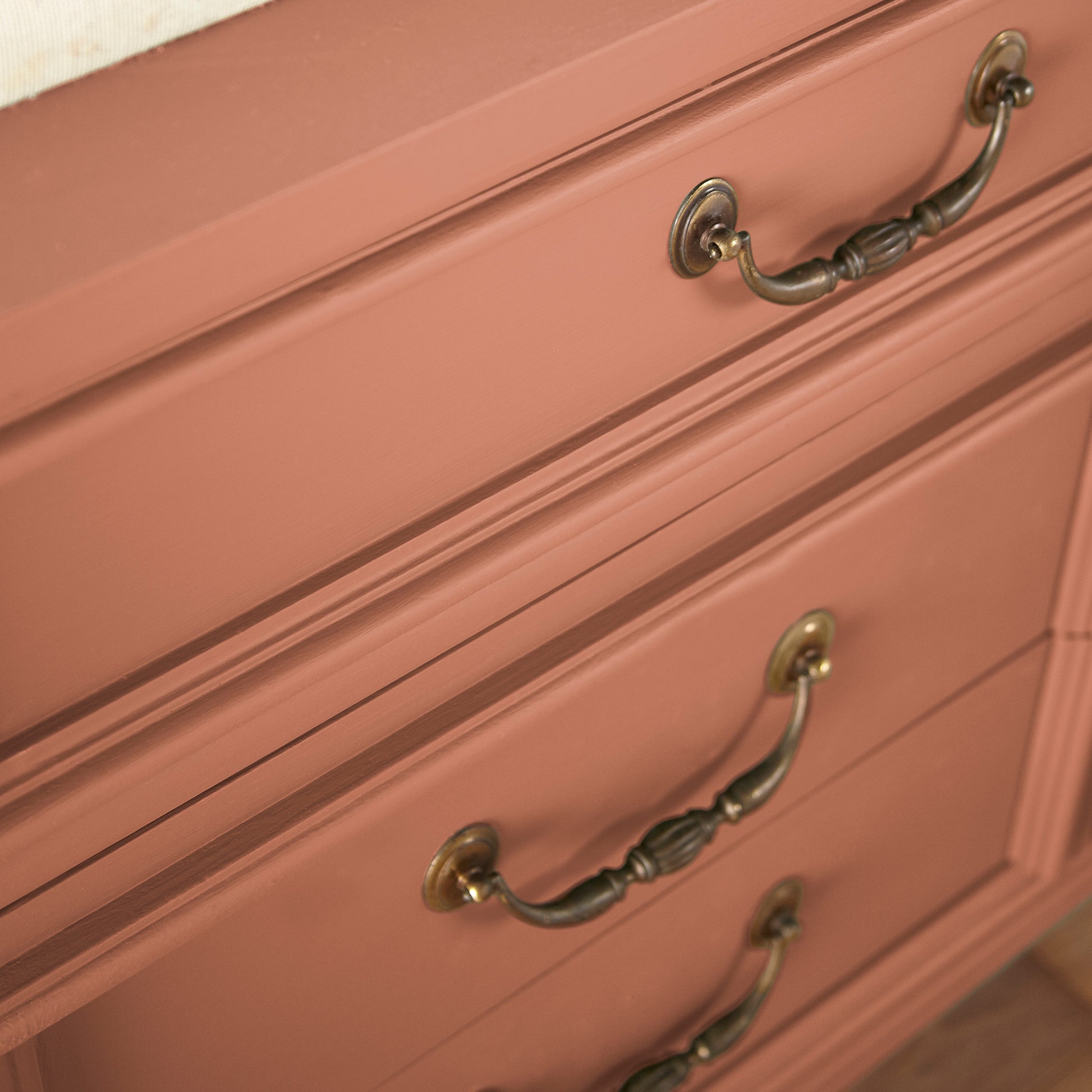 muted burnt orange door and cabinet paint named work worn wood shown painted on cabinet