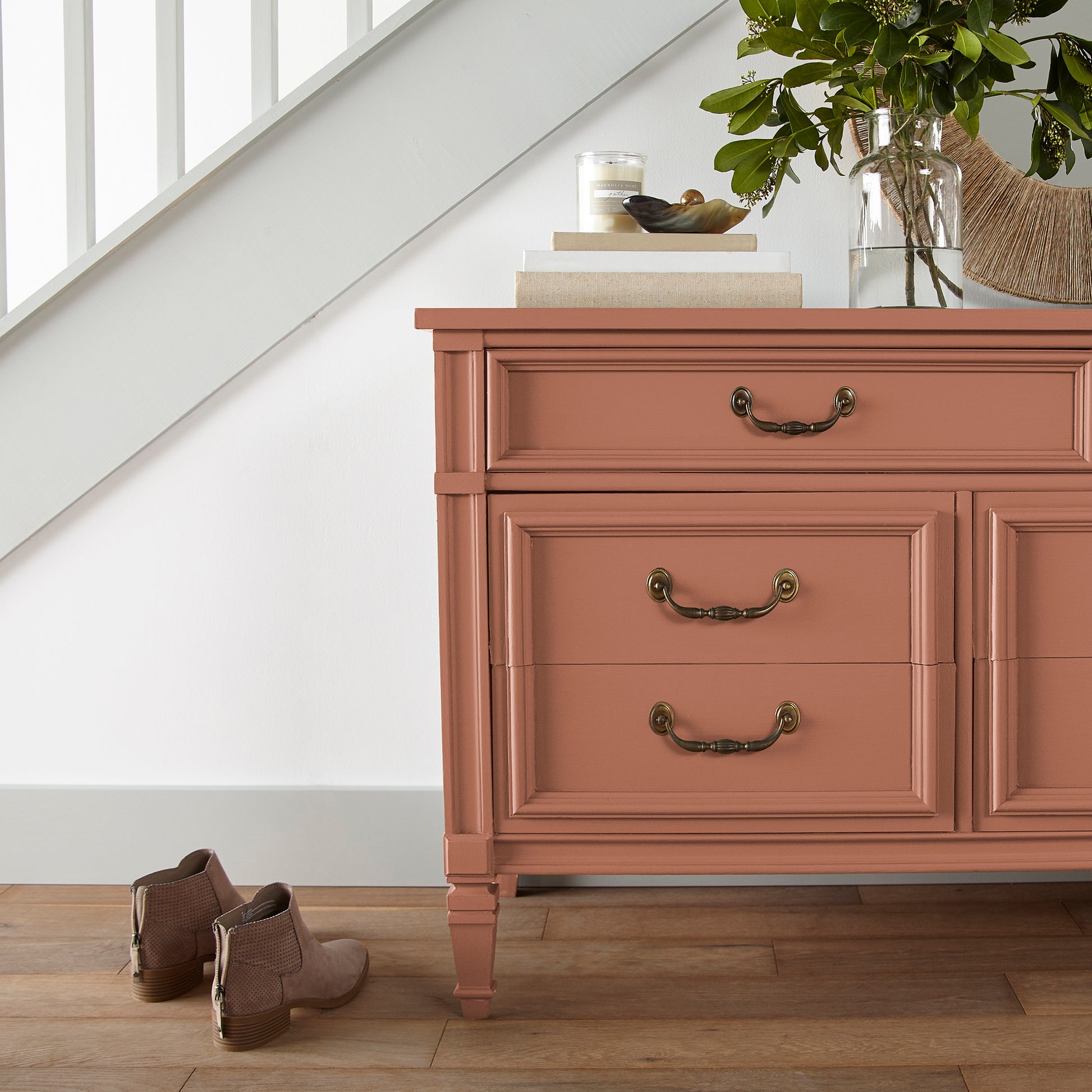 muted burnt orange door and cabinet paint named work worn wood shown painted on entryway cabinet