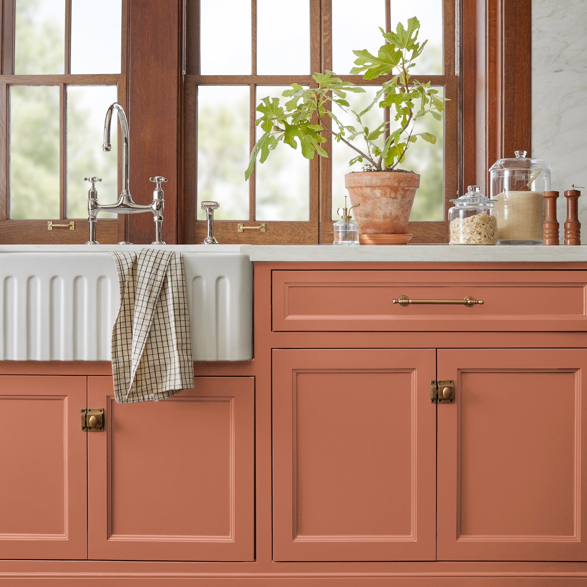 muted burnt orange door and cabinet paint named work worn wood shown painted on kitchen cabinet
