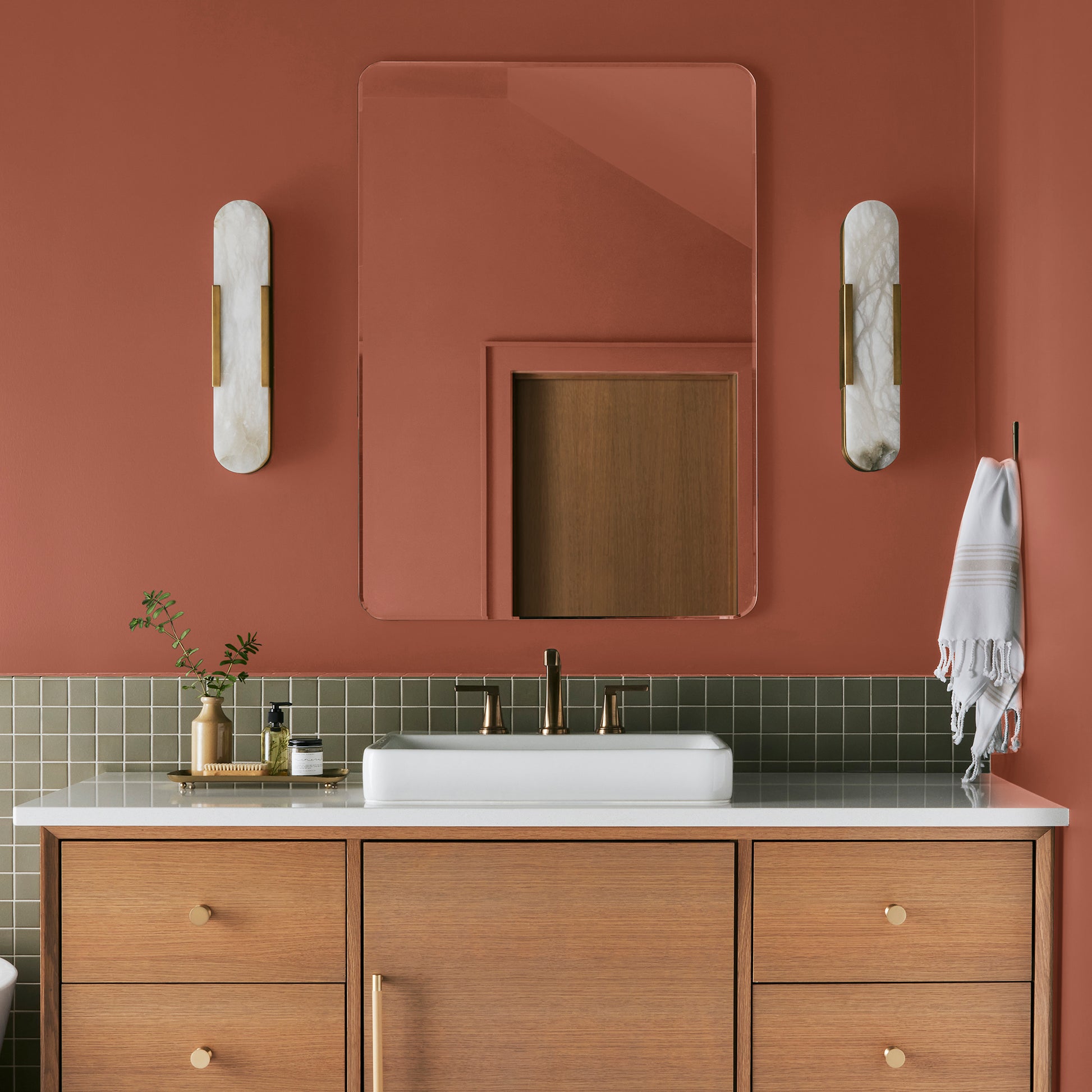 Deep Terra Cotta interior paint named on bosque shown painted on bathroom wall