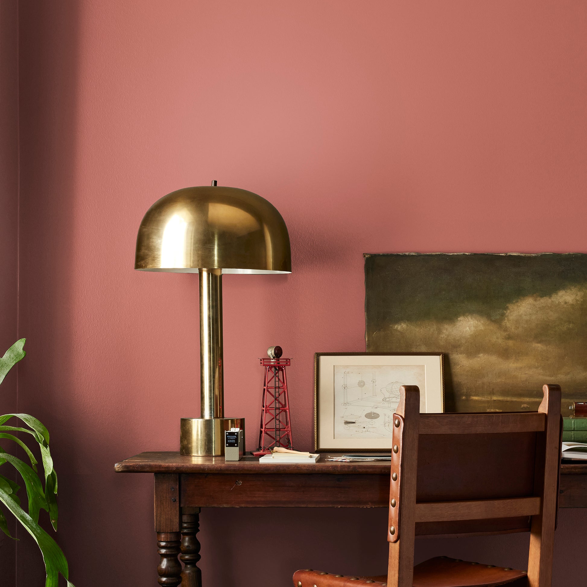 dark rust-red paint named home at last shown painted on bedroom wall