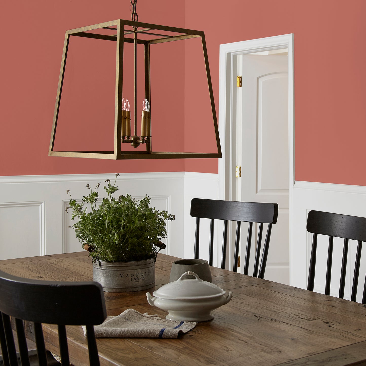 dark rust-red paint named home at last shown painted on dining room wall