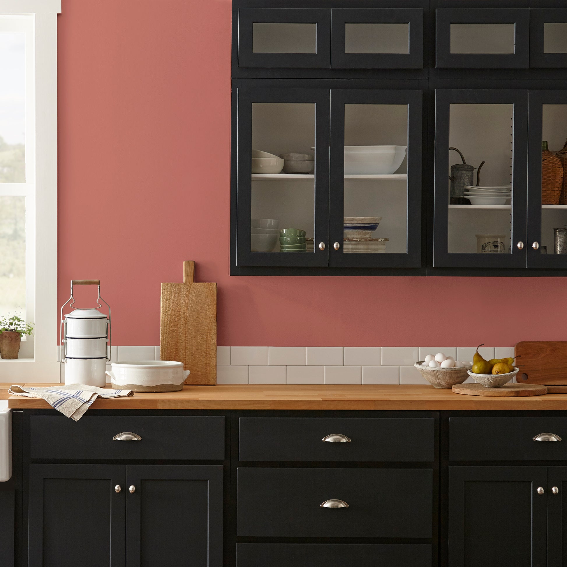 dark rust-red paint named home at last shown painted on kitchen wall