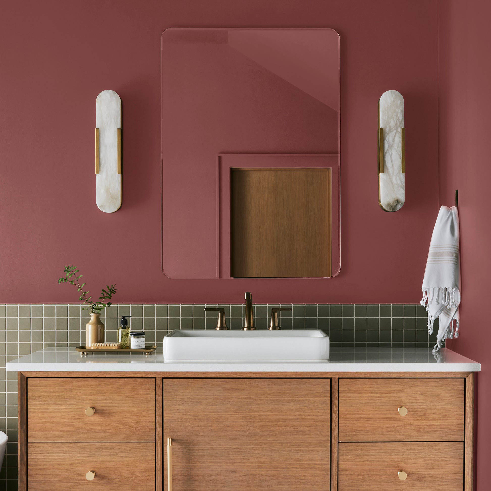 deep red paint named create shown painted on bathroom wall