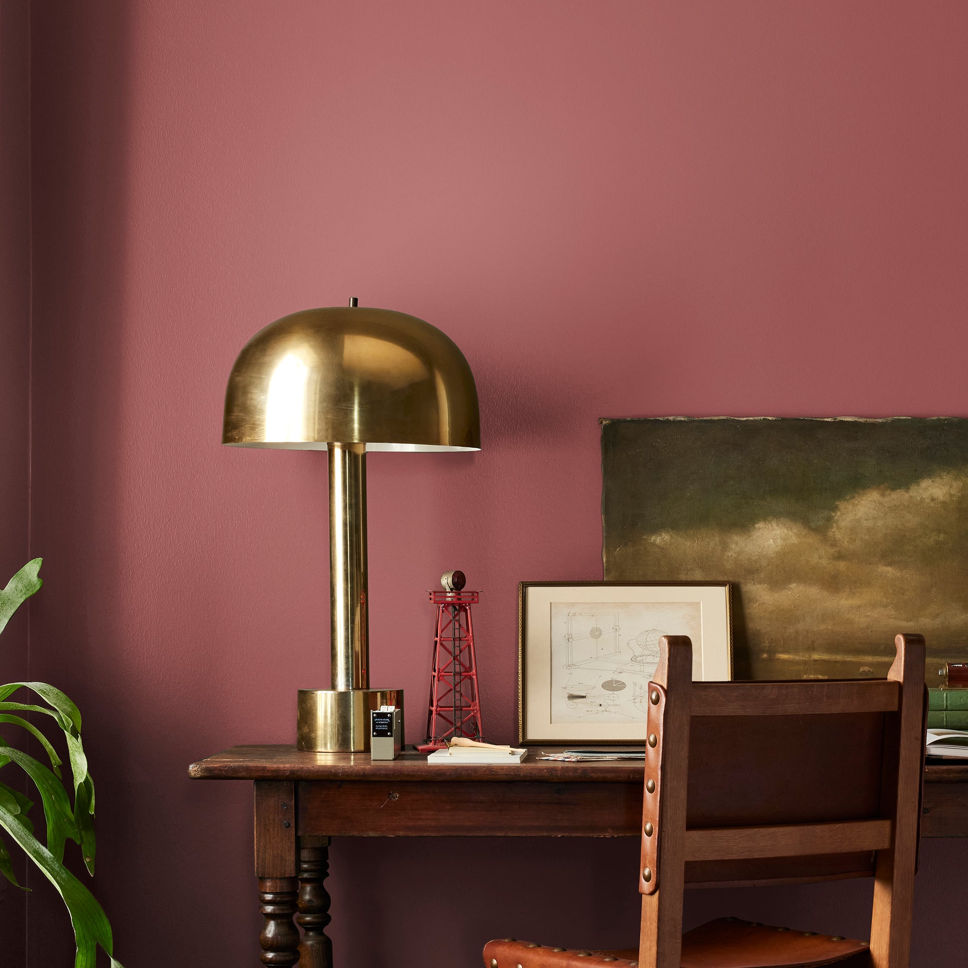 deep red paint named create shown painted on bedroom wall