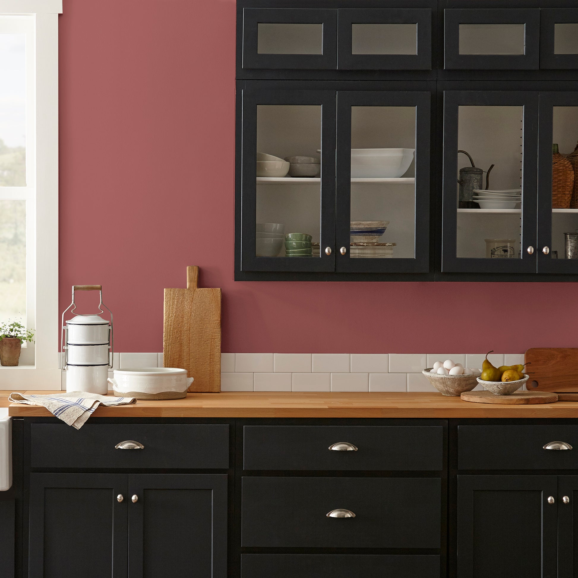 deep red paint named create shown painted on kitchen wall