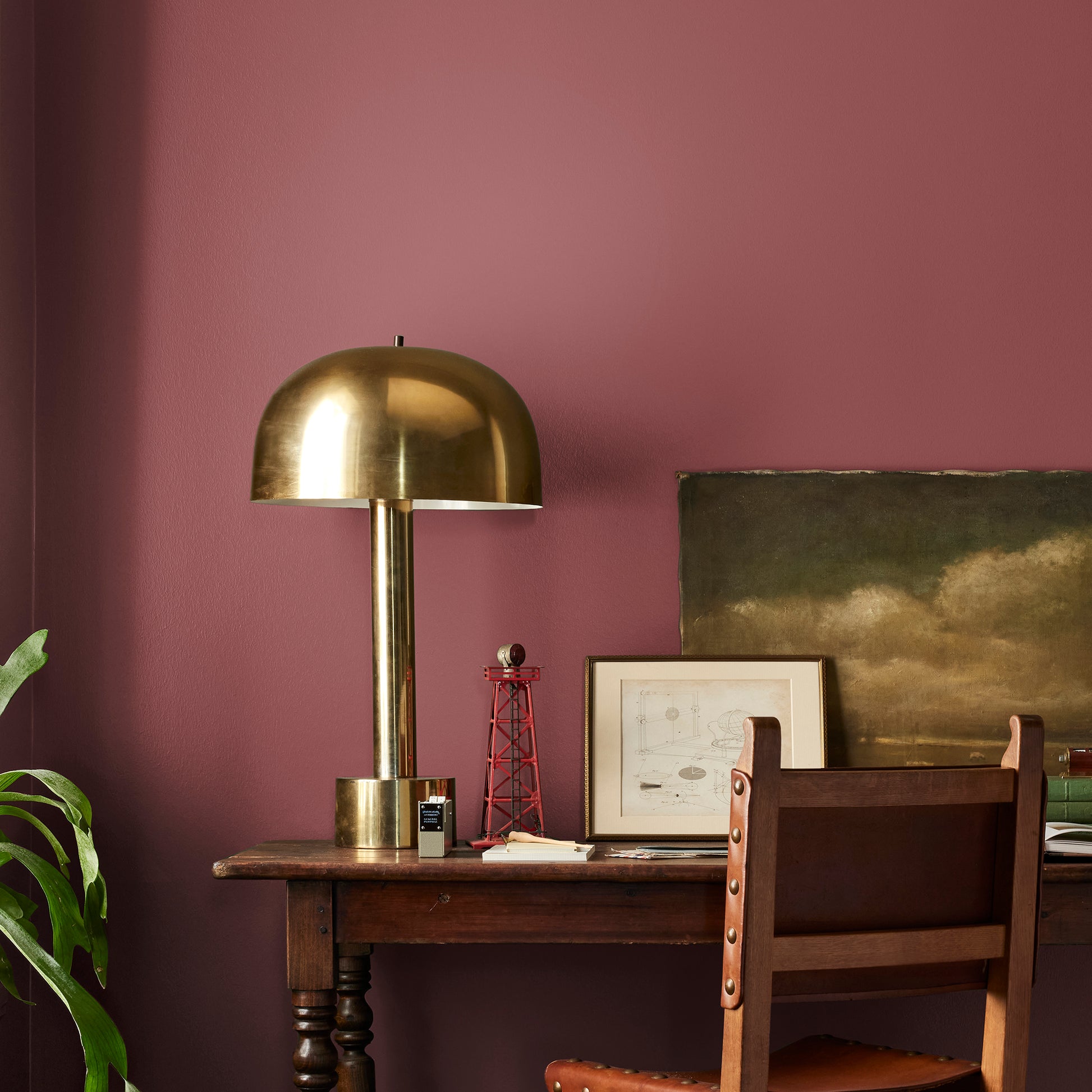 Deep antique red interior paint named by the fireplace shown painted on bedroom wall