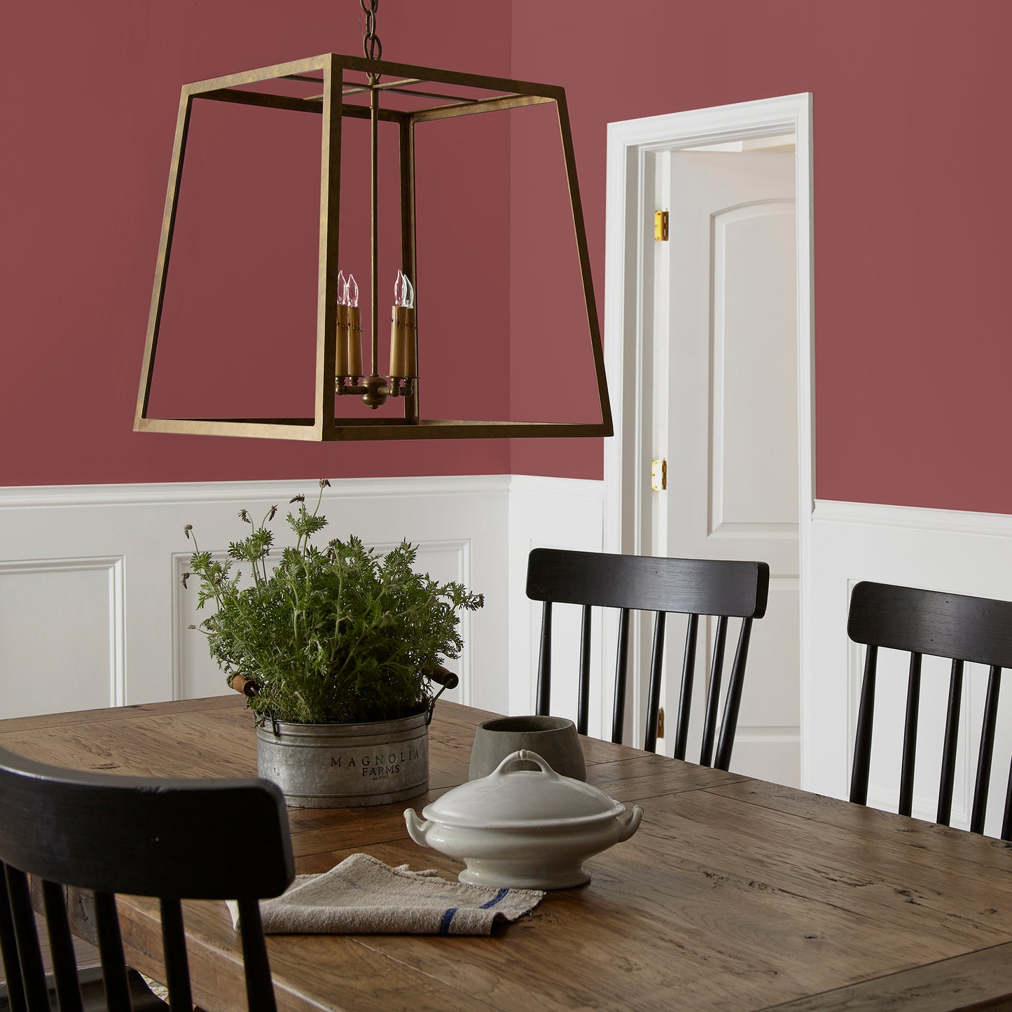Deep antique red interior paint named by the fireplace shown painted on dining room wall
