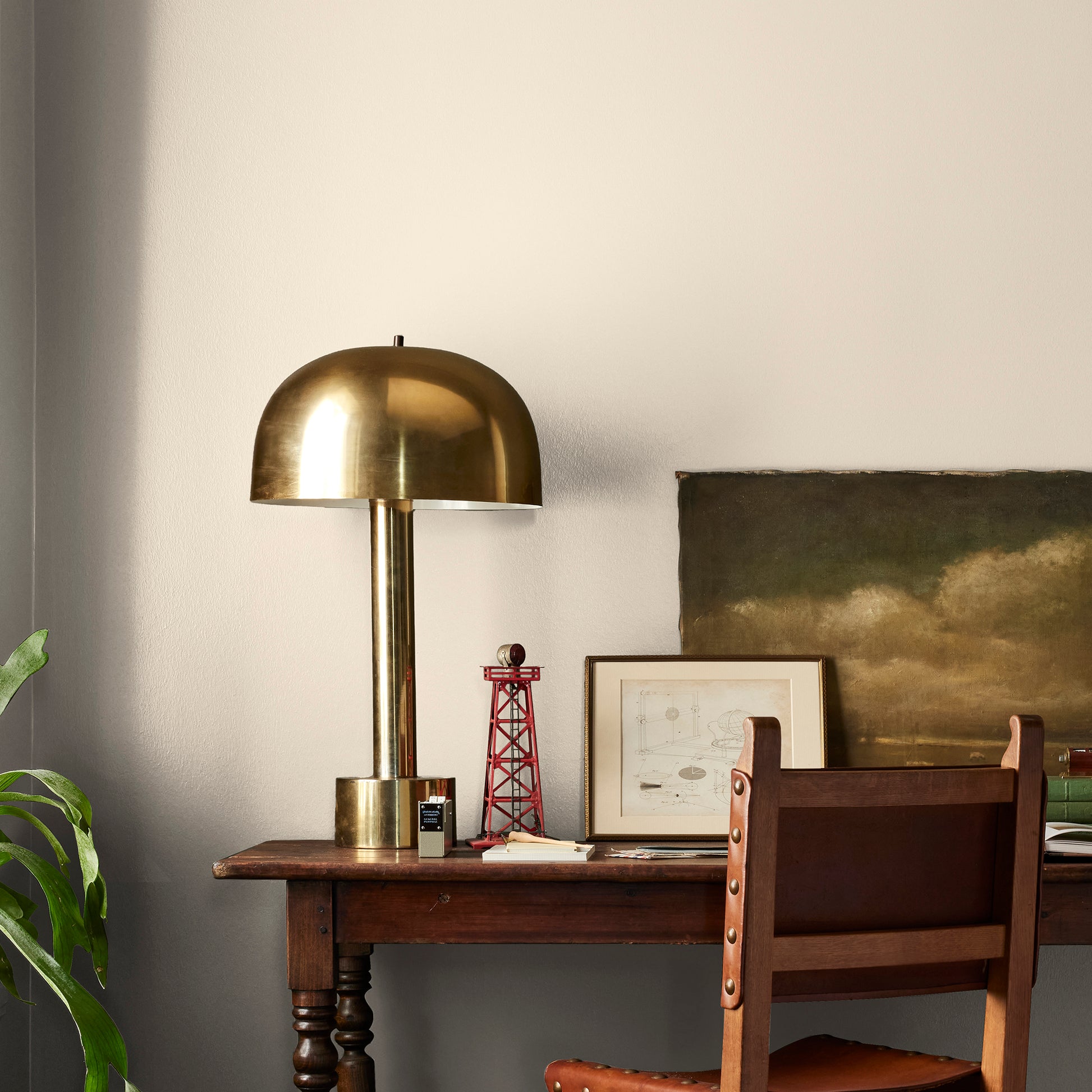 Warm white with soft notes of beige and honey interior paint named lit candles shown painted on bedroom wall