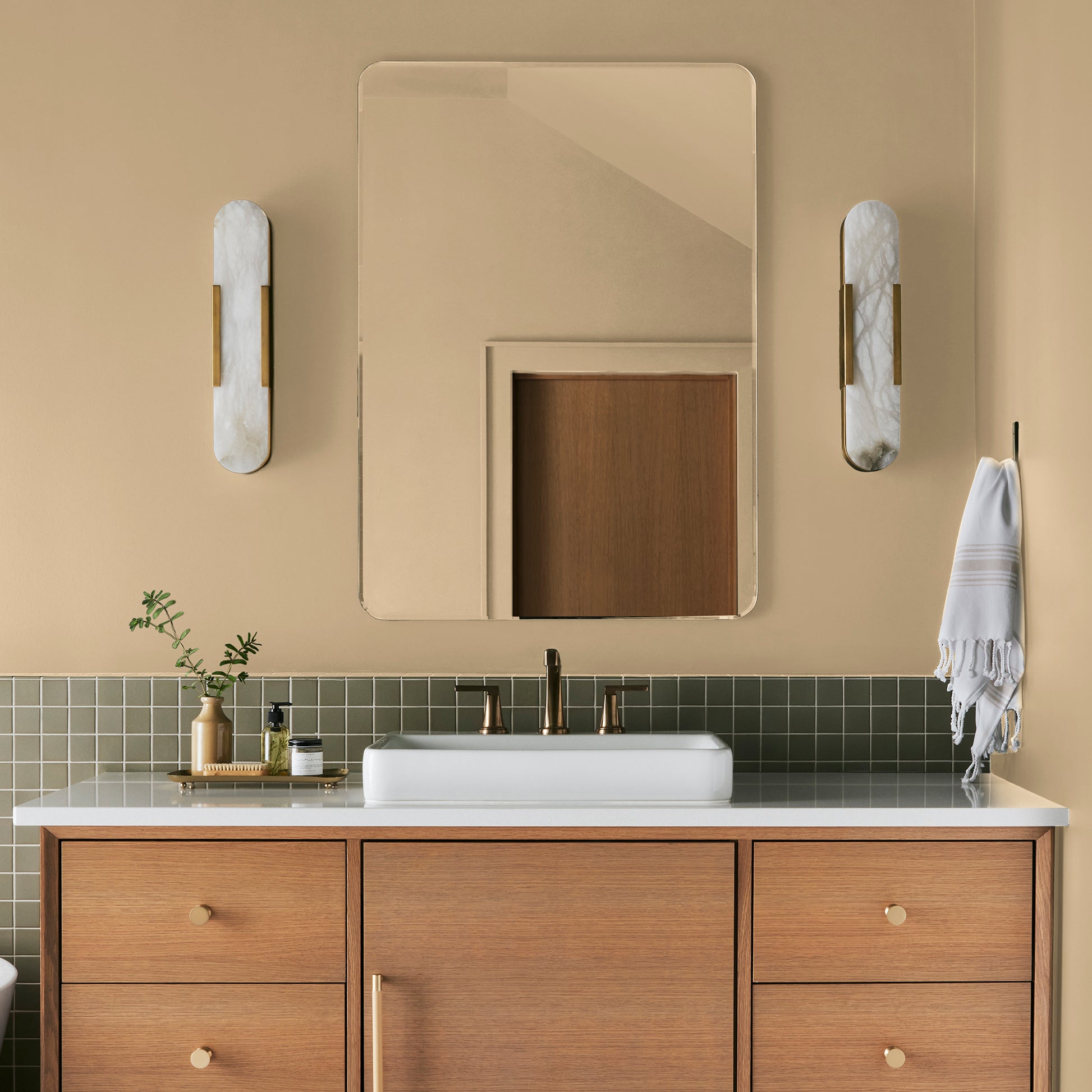 Creamy honey and citrus yellow interior paint named lemony shown painted on bathroom wall