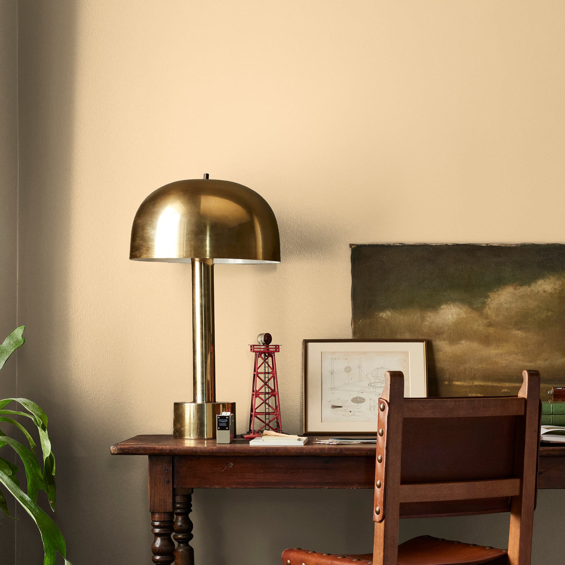 Creamy honey and citrus yellow interior paint named lemony shown painted on bedroom wall