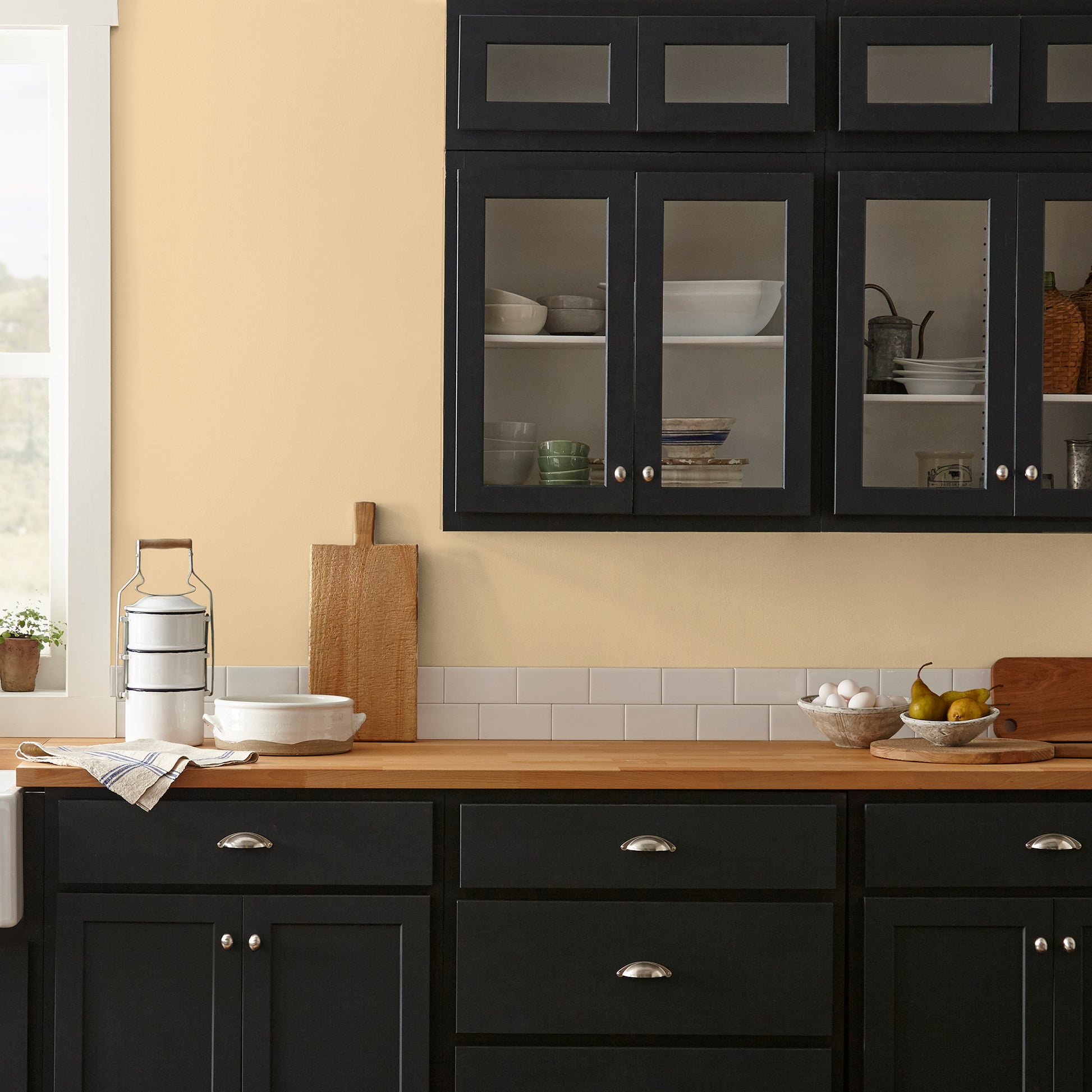 Creamy honey and citrus yellow interior paint named lemony shown painted on kitchen wall