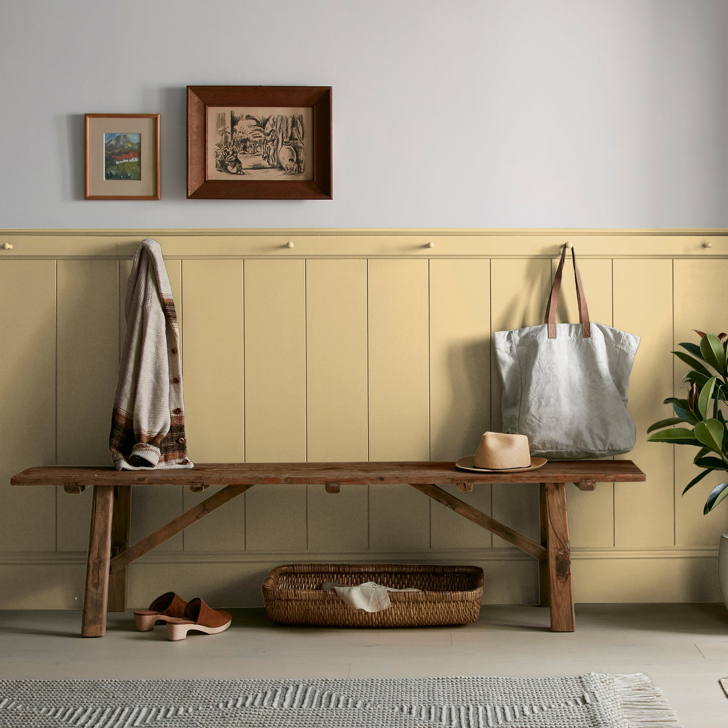 muted yellow with green undertones paint named heirloom yellow shown painted on entryway wall