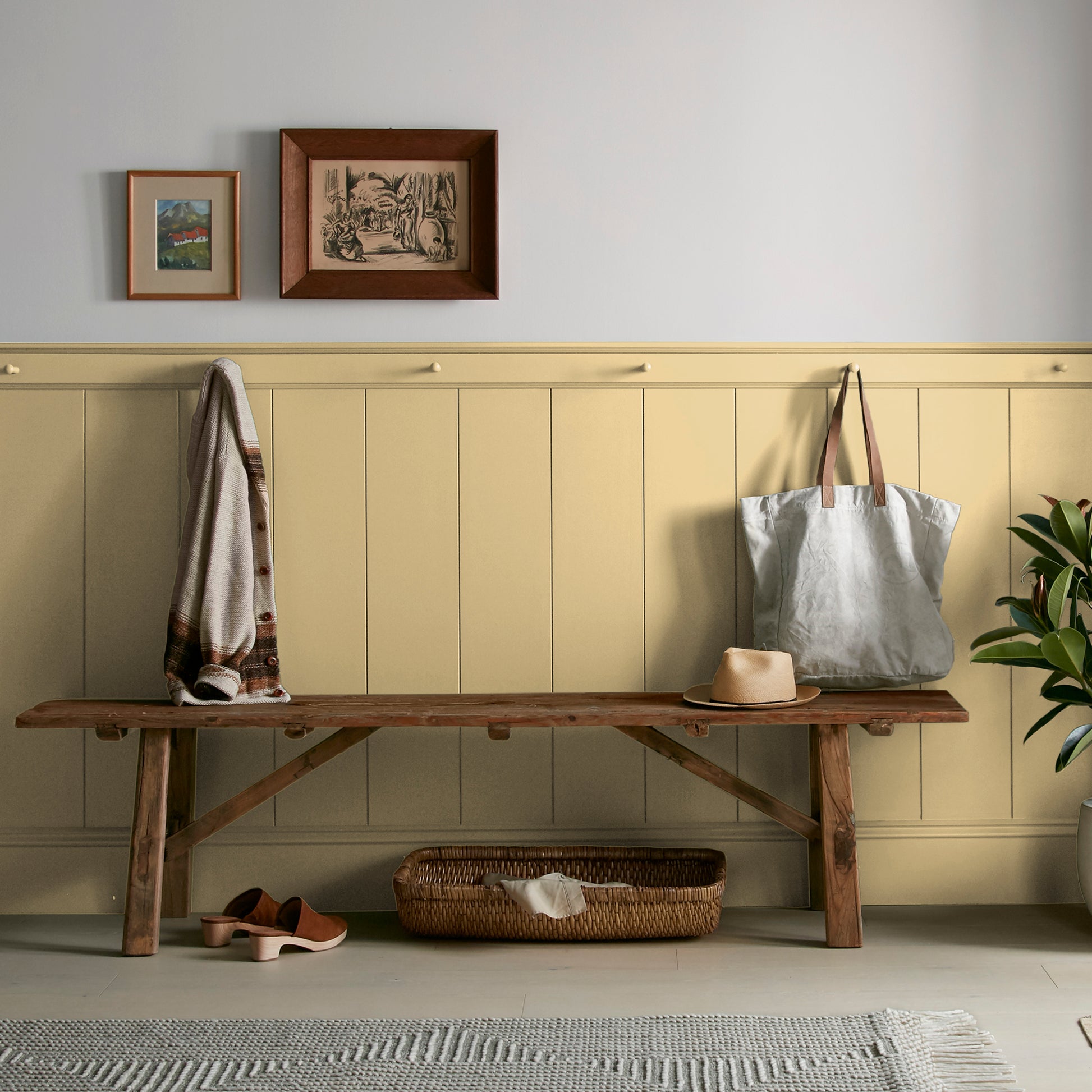 muted yellow with green undertones paint named heirloom yellow shown painted on entryway wall